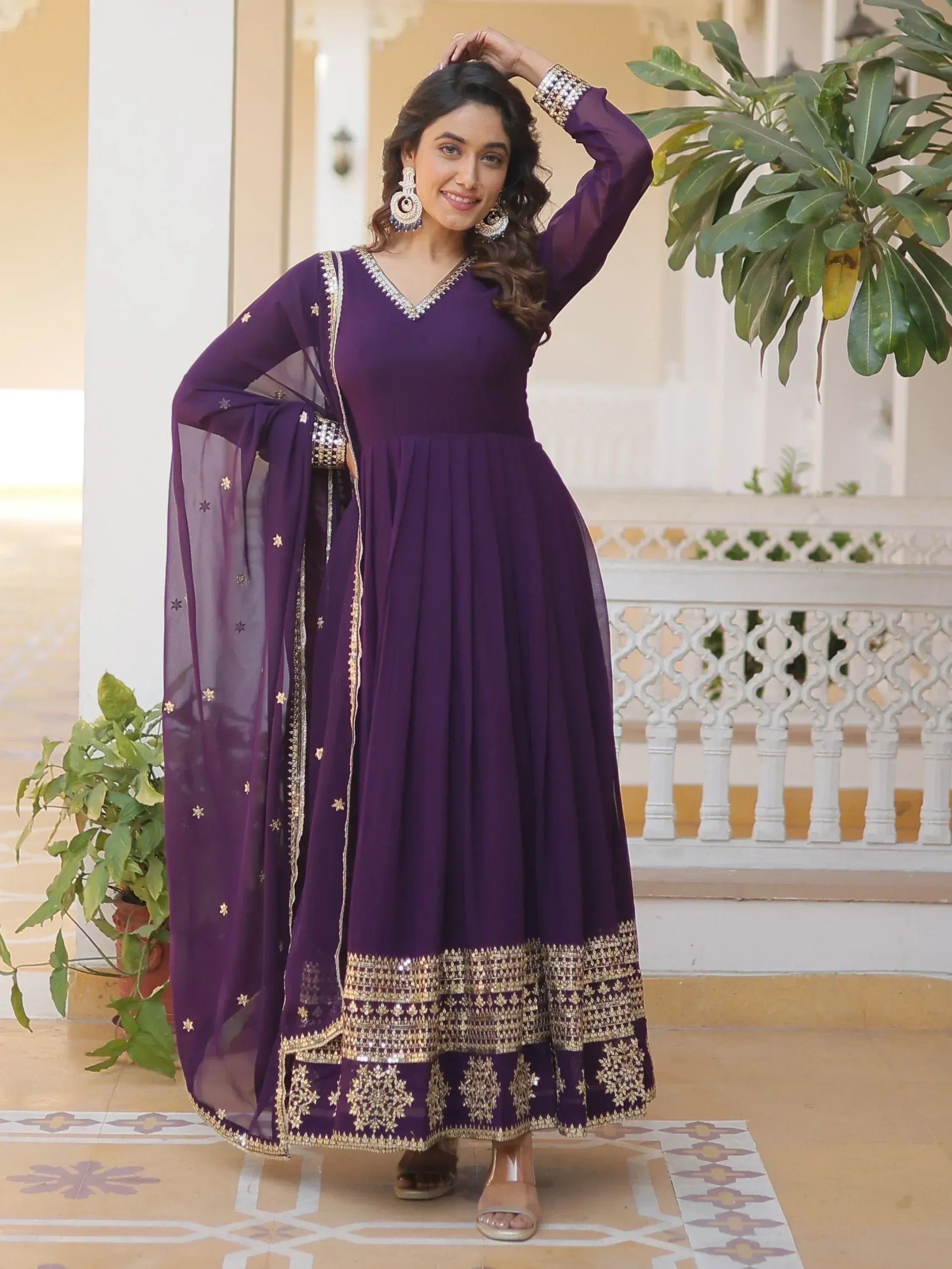 Purple ethnic anarkali gown with gold embroidery and sheer dupatta, perfect for Indian occasions