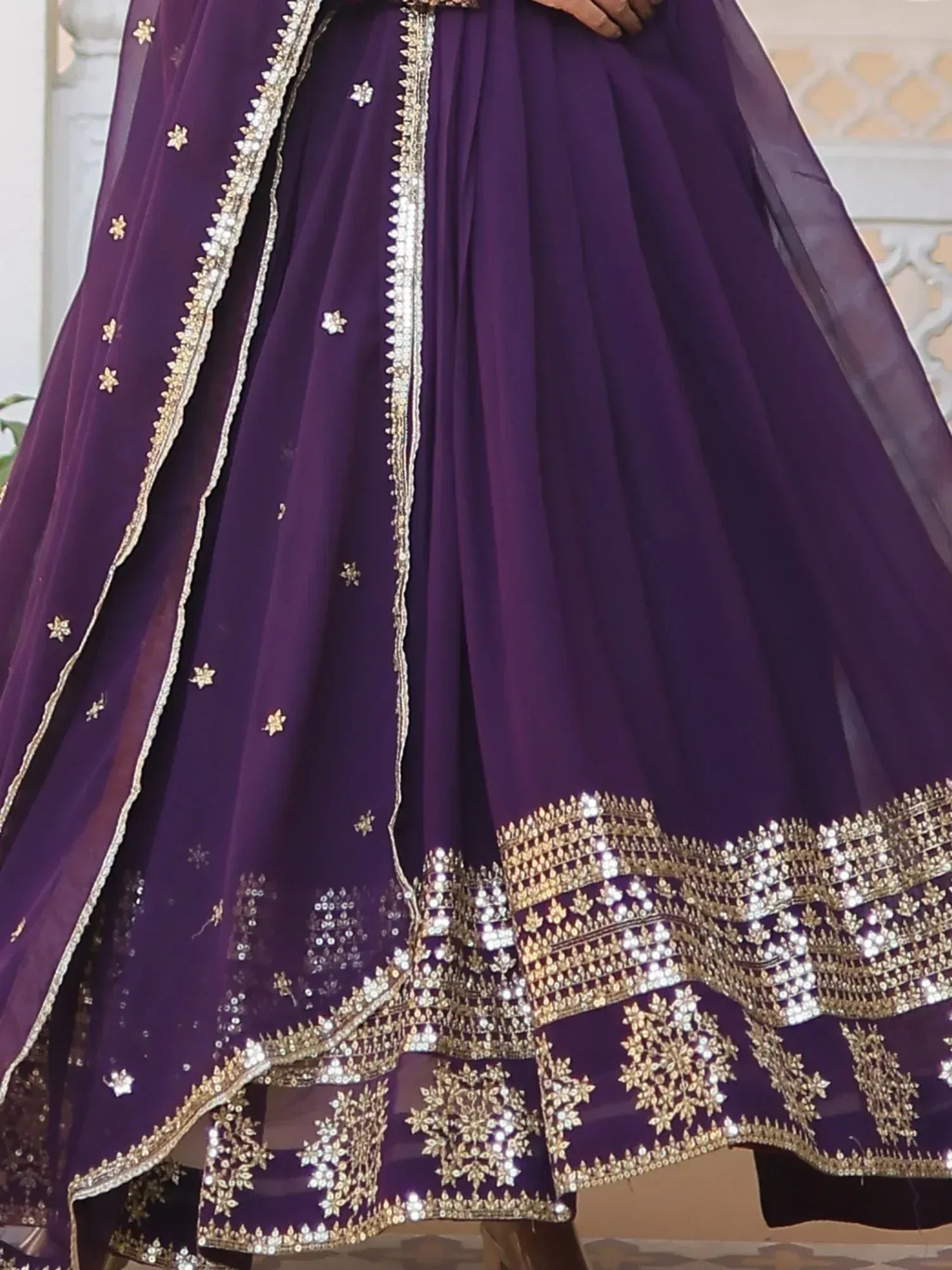 Purple designer lehenga with gold embroidery and sequin work, perfect for Indian ethnic occasions