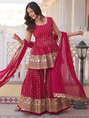 Woman in pink embroidered Indian ethnic lehenga suit with dupatta, gold accents, traditional wear