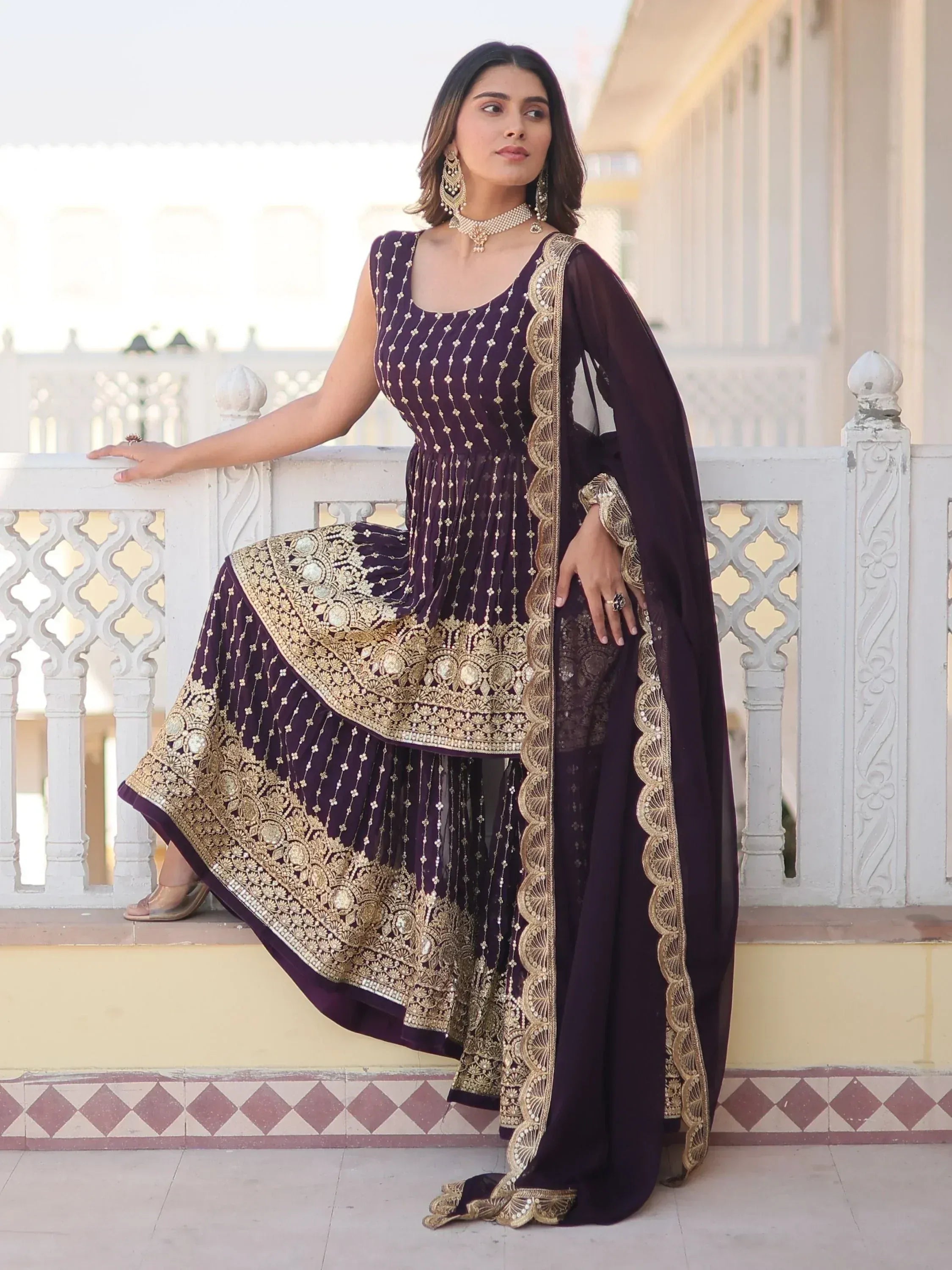Elegant purple designer anarkali with gold embroidery and dupatta, perfect for Indian ethnic wear occasions.