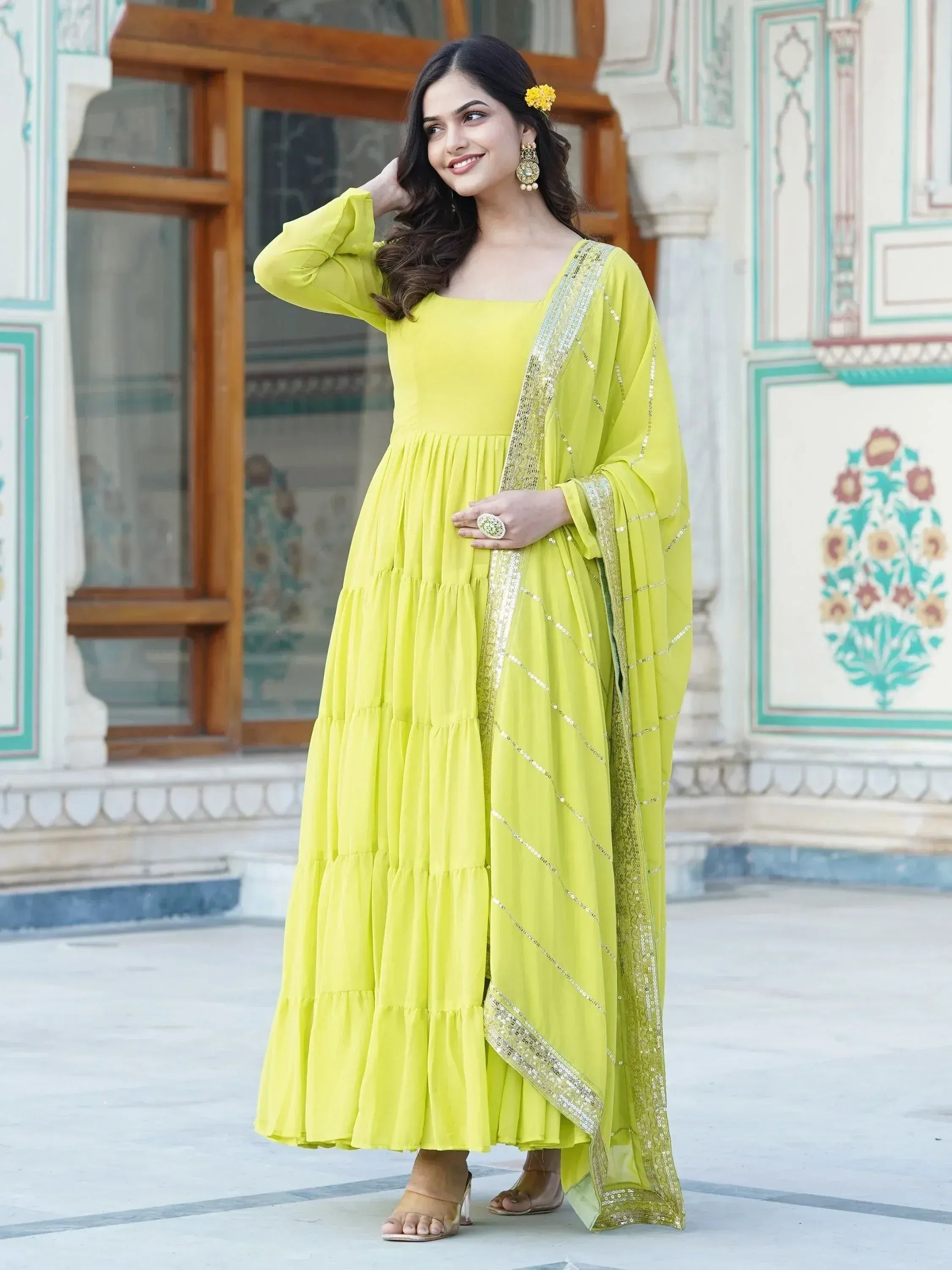 Vibrant yellow tiered ethnic gown with sequin dupatta, perfect for festive occasions