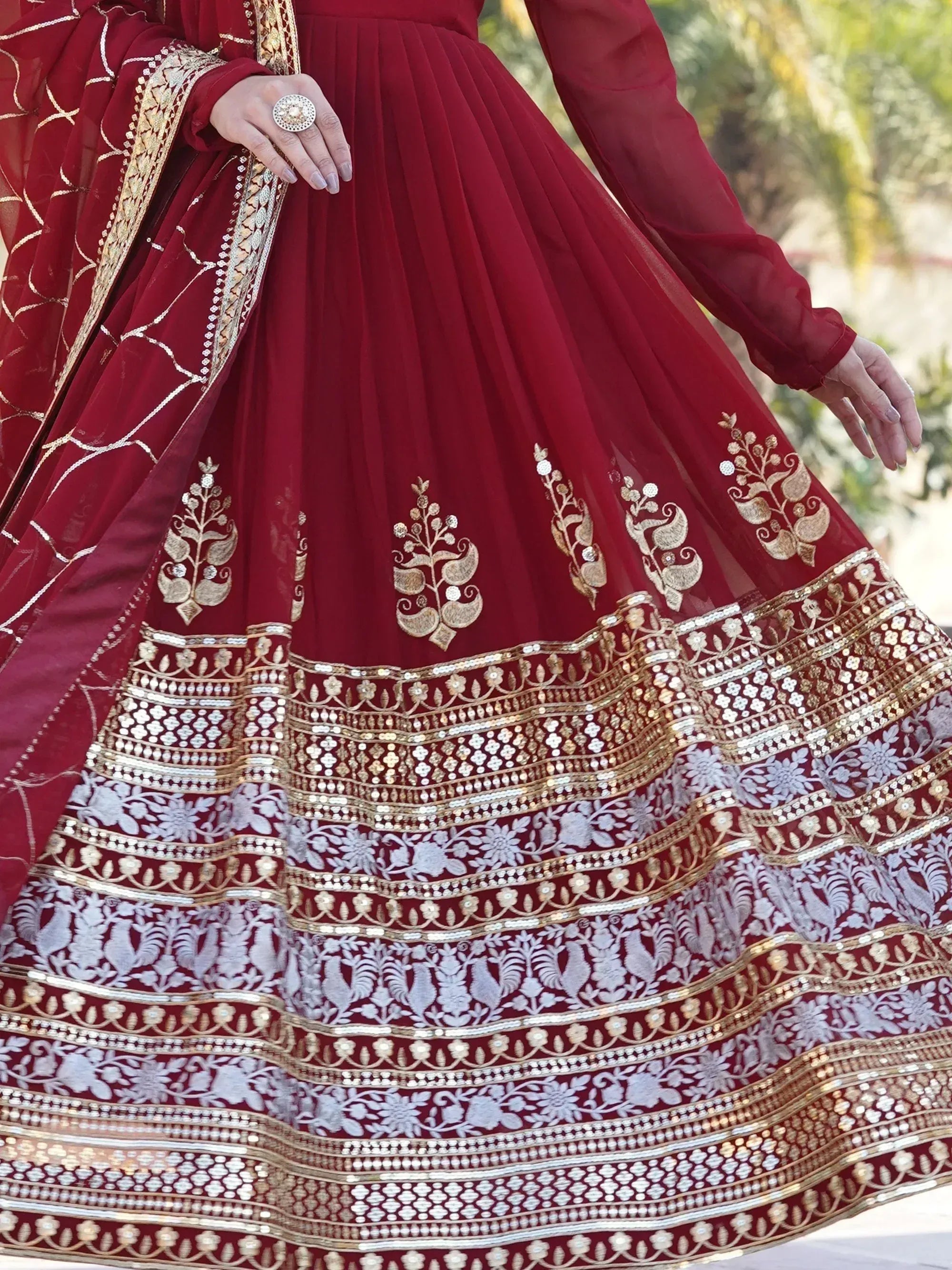 Maroon designer lehenga with gold and silver embroidery, perfect for Indian weddings and festive occasions