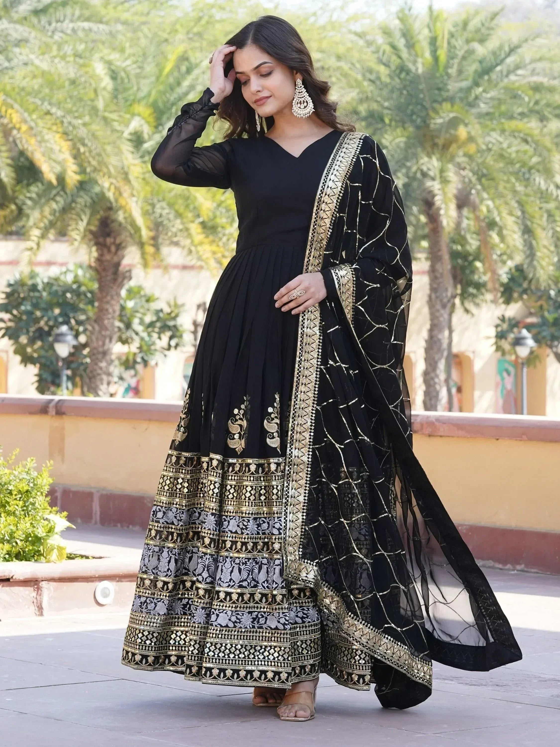 Black and gold embroidered anarkali suit with sheer dupatta, perfect for Indian ethnic occasions