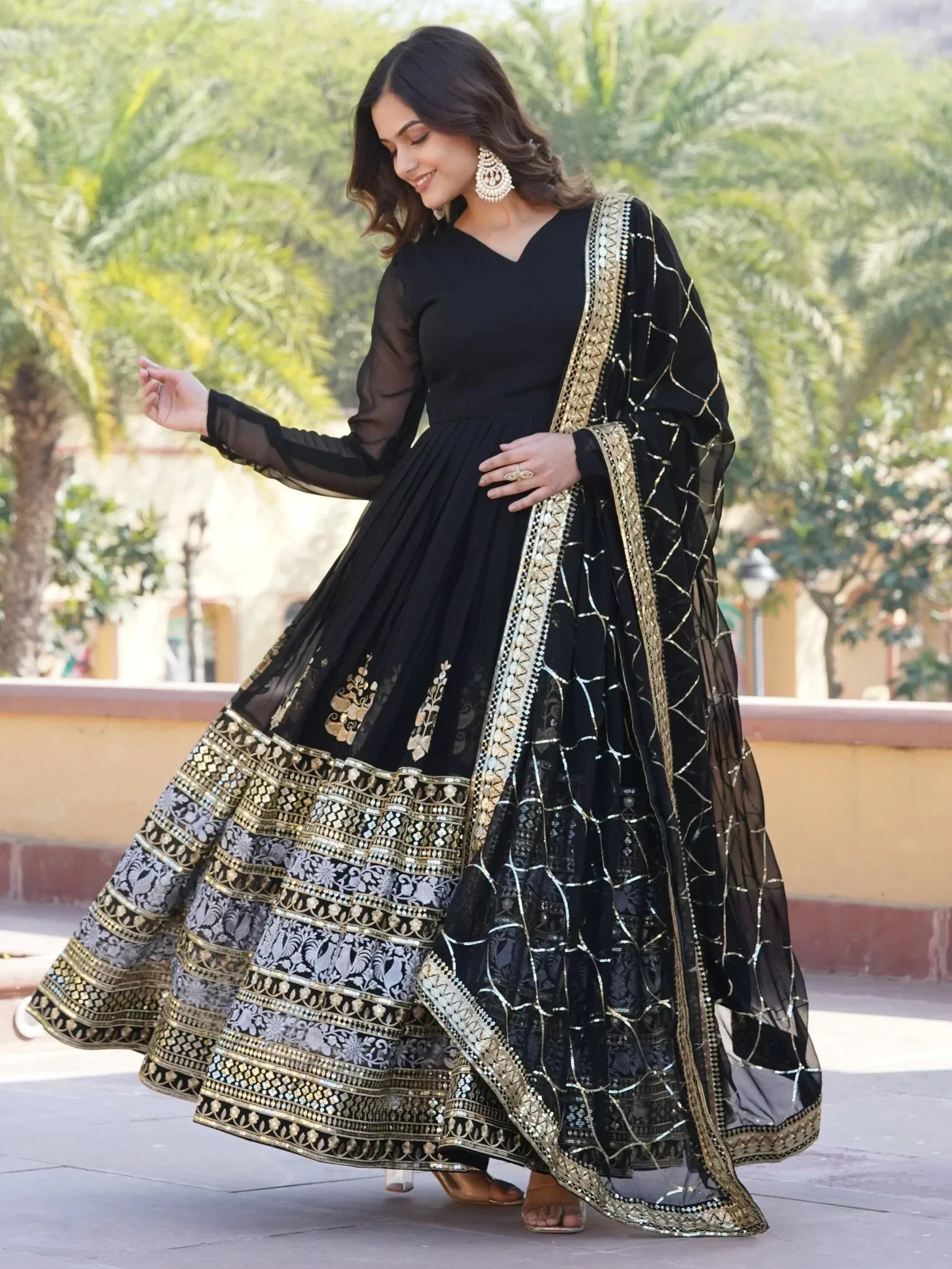 Black and gold embroidered anarkali suit with sheer dupatta, perfect for Indian ethnic wear occasions