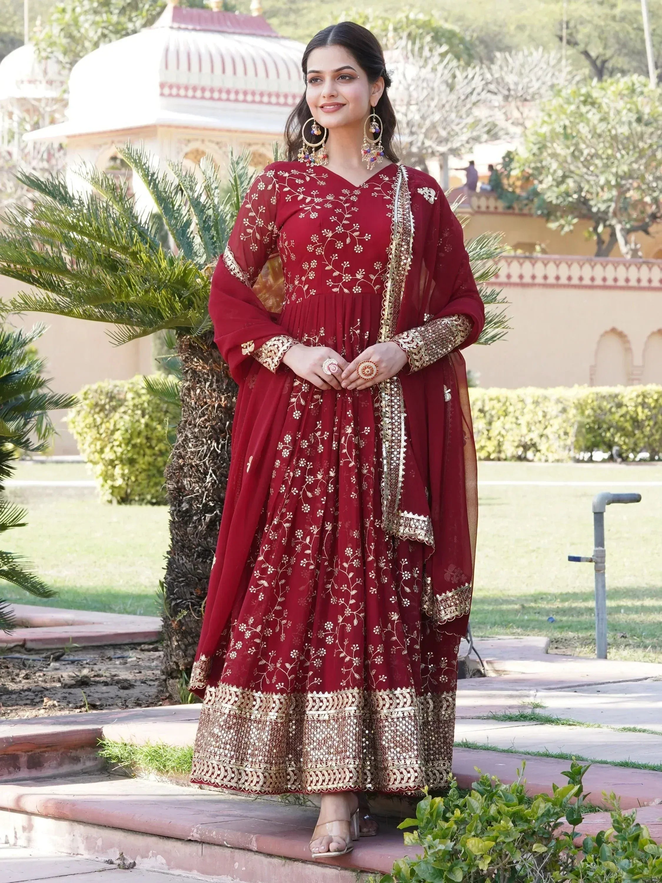 Maroon embroidered anarkali suit with gold detailing, perfect for Indian ethnic occasions and weddings.