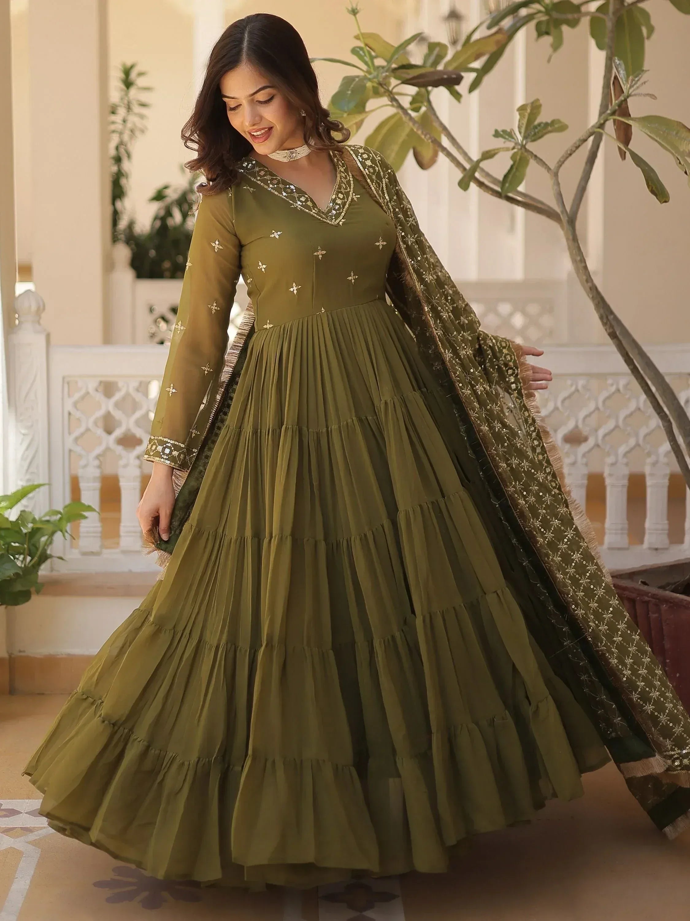 Olive green embroidered anarkali gown with pleated skirt and matching dupatta, perfect for Indian ethnic occasions.