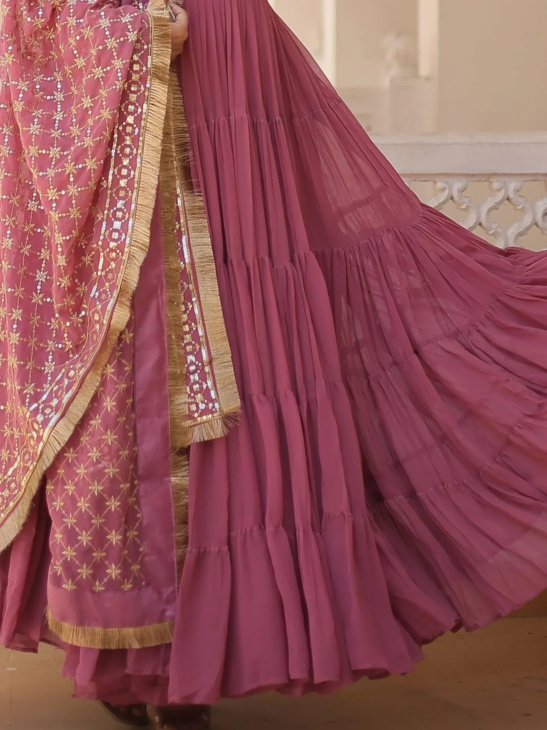 Pink embroidered lehenga choli with gold detailing and pleated skirt, Indian ethnic wear