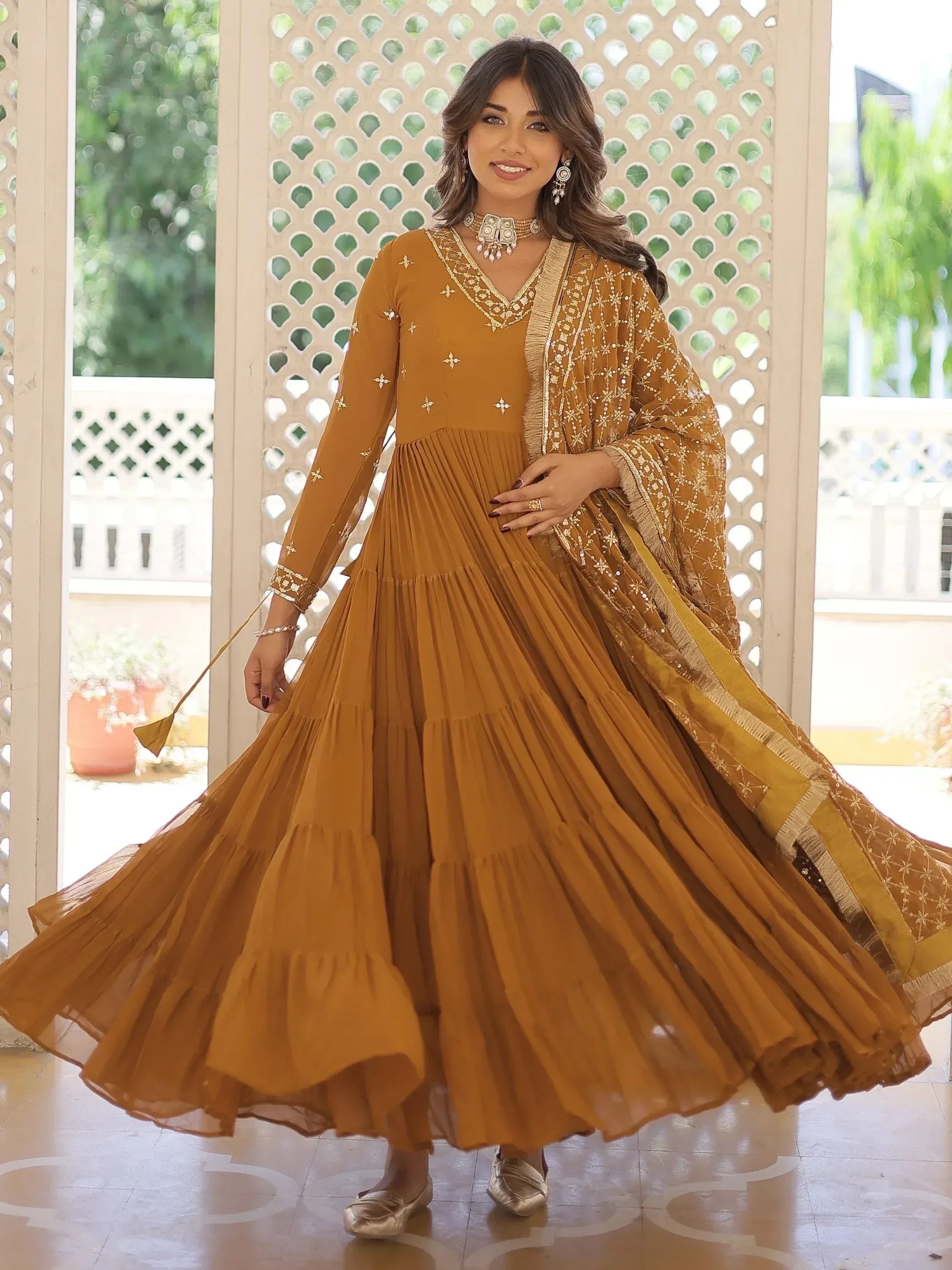 Mustard ethnic anarkali gown with gold embroidery, pleated skirt, and dupatta for Indian occasions