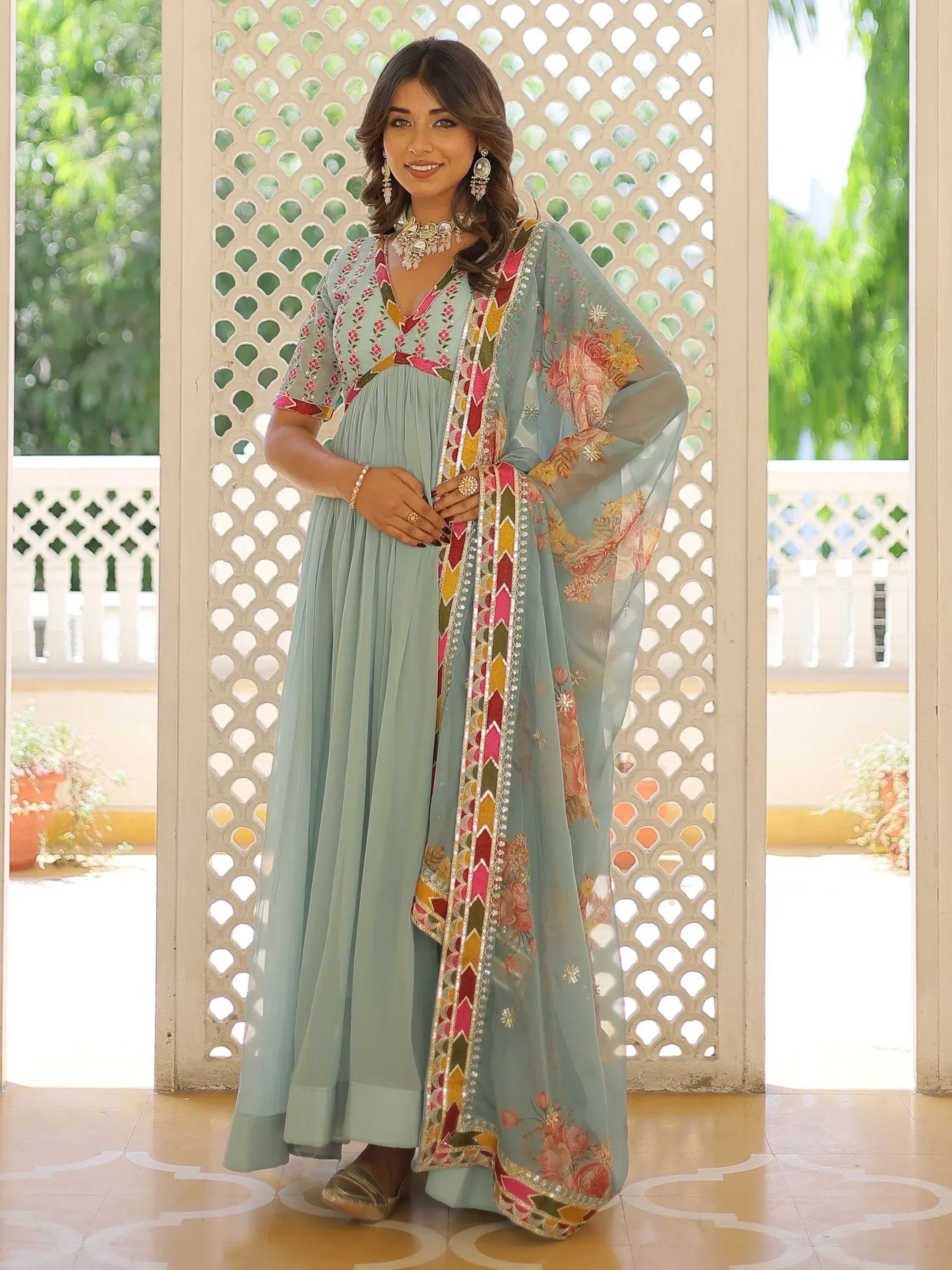 Light blue embroidered anarkali suit with floral dupatta, perfect for Indian ethnic occasions
