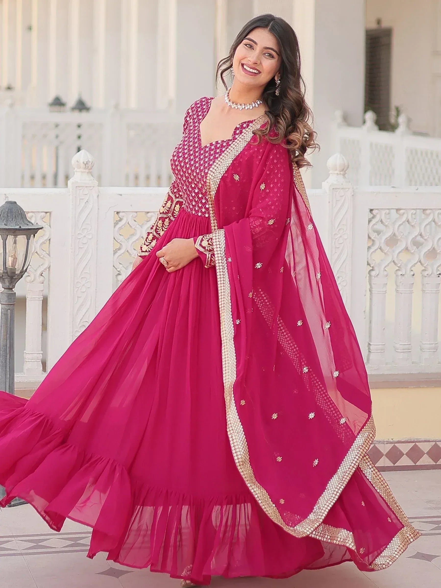 Fuchsia pink designer anarkali with gold embroidery and dupatta, perfect for Indian ethnic occasions