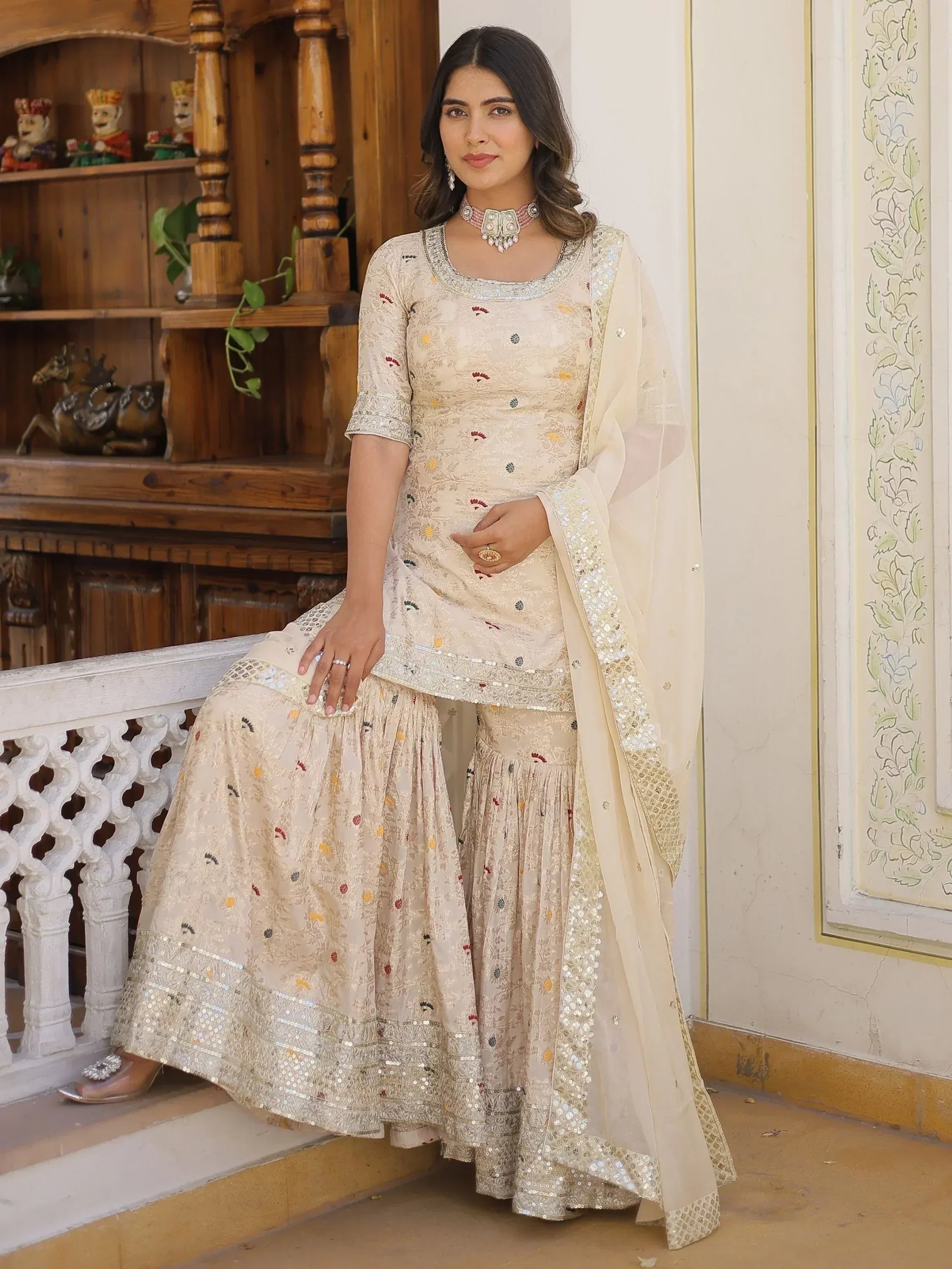 Elegant cream floral embroidered lehenga choli with sequin dupatta, perfect for Indian ethnic occasions.