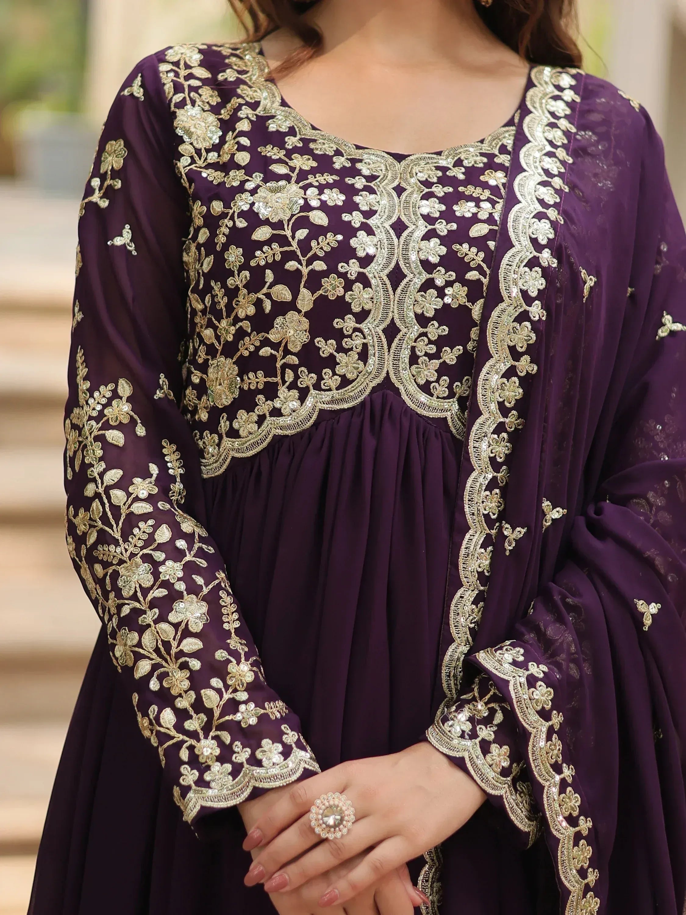 Purple ethnic gown with gold floral embroidery, perfect for Indian occasions and festive wear.