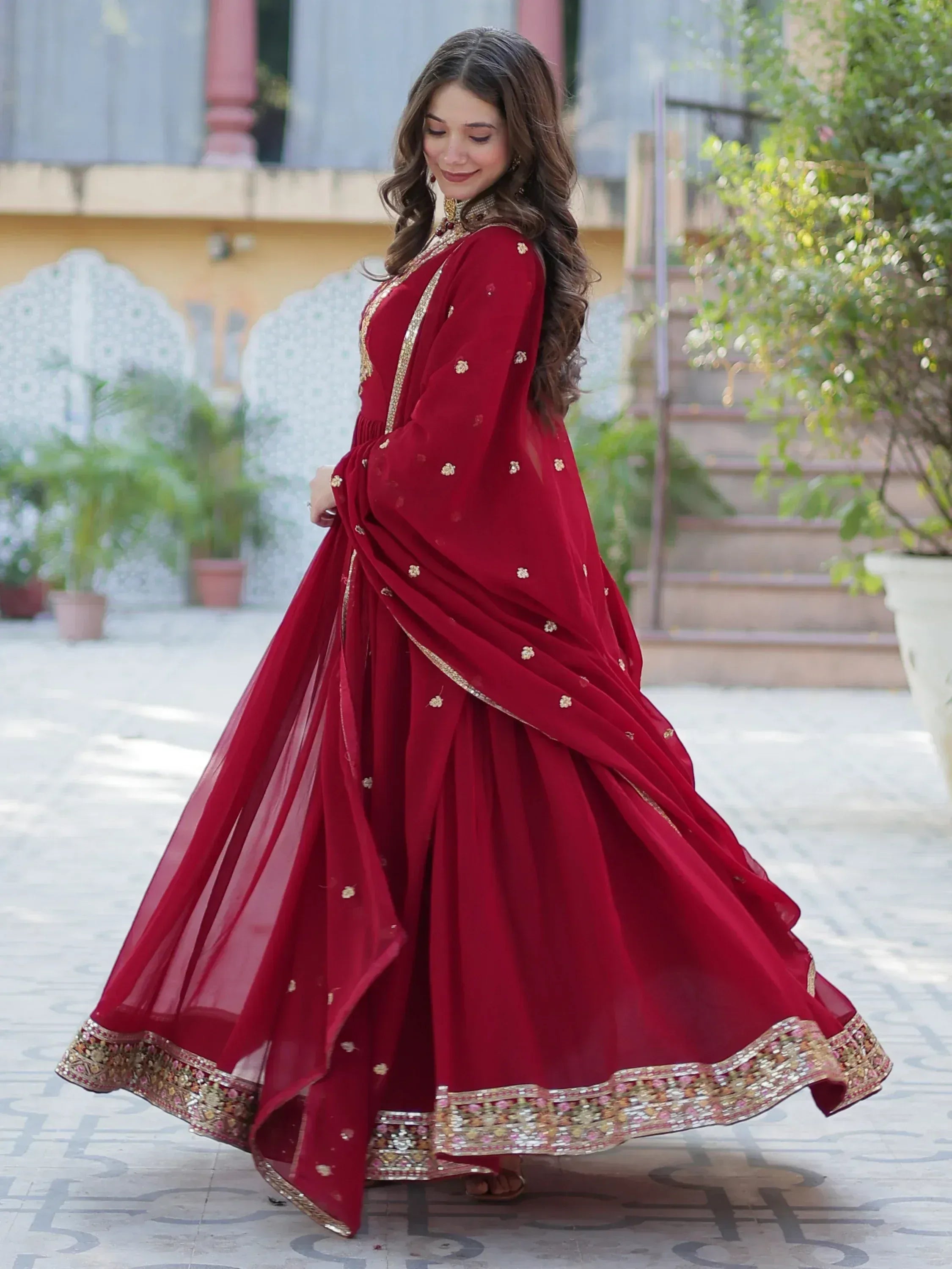 Elegant maroon Indian lehenga choli with gold embroidery, perfect for weddings and festive occasions.