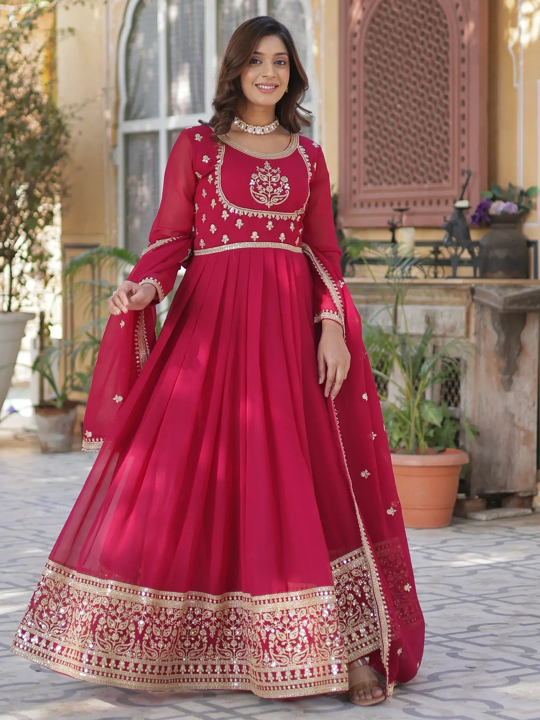 Red embroidered anarkali gown with gold detailing, perfect for Indian ethnic occasions