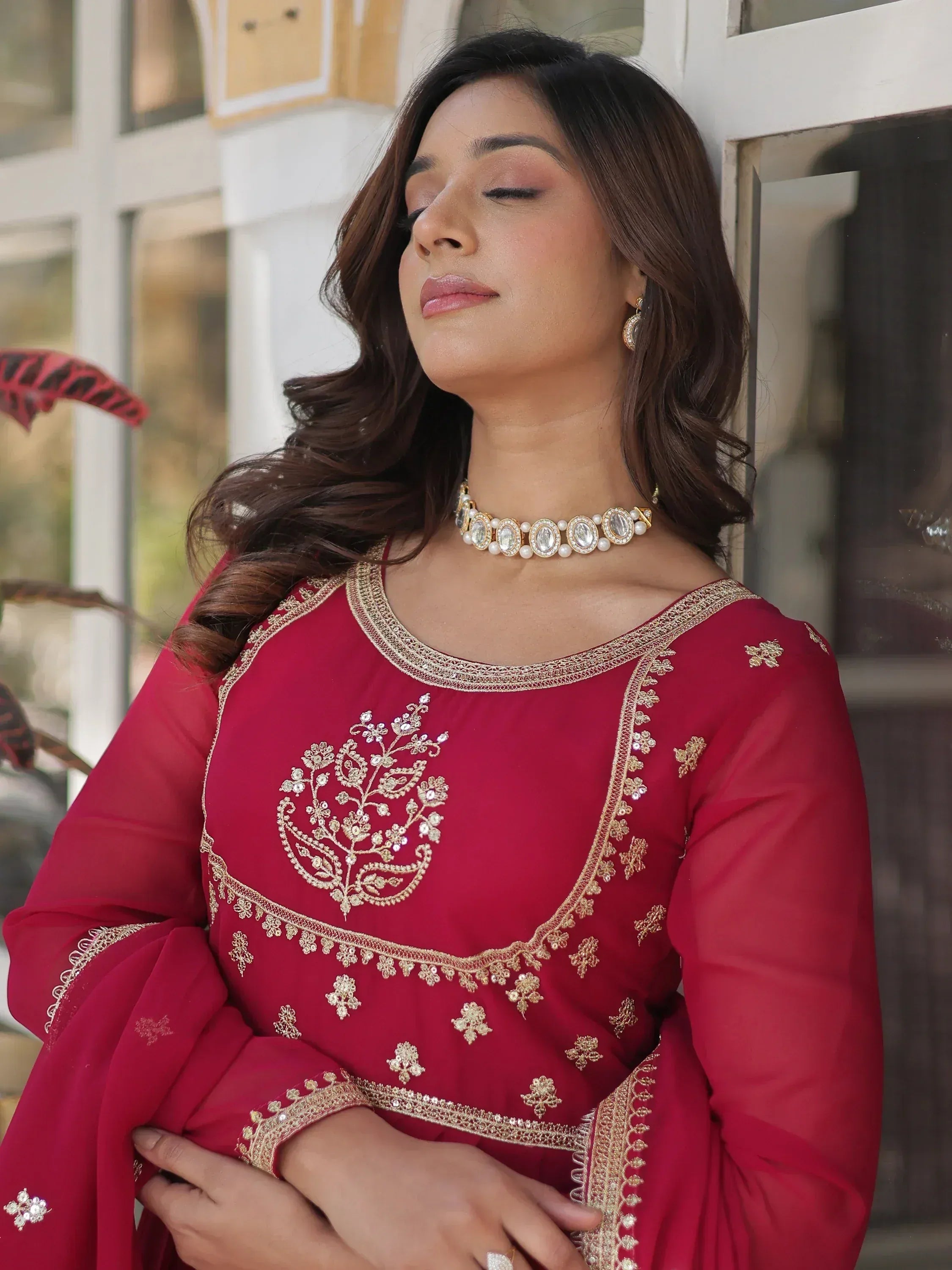 Woman in maroon ethnic kurta with gold embroidery, perfect for Indian festive occasions