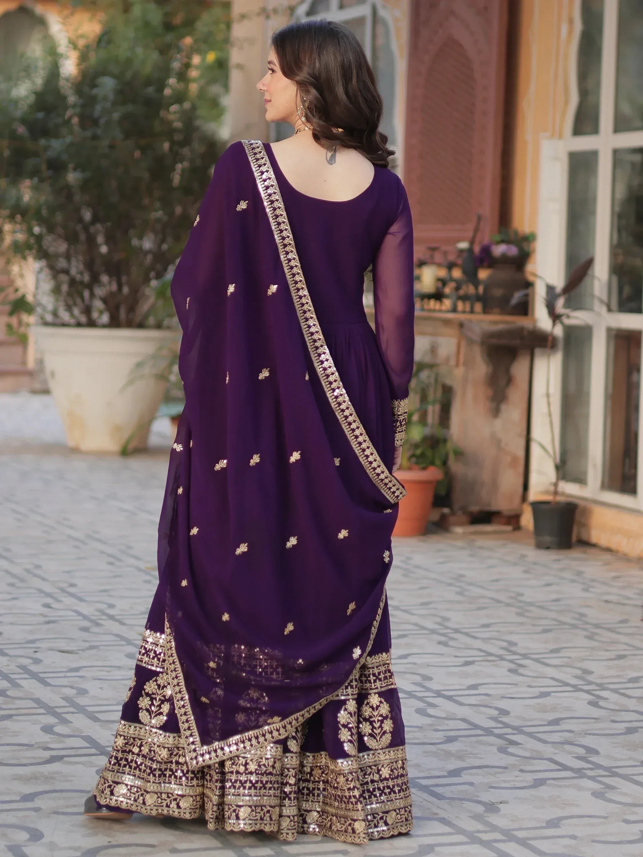 Purple designer salwar kameez with gold embroidery and sheer sleeves, perfect for ethnic occasions
