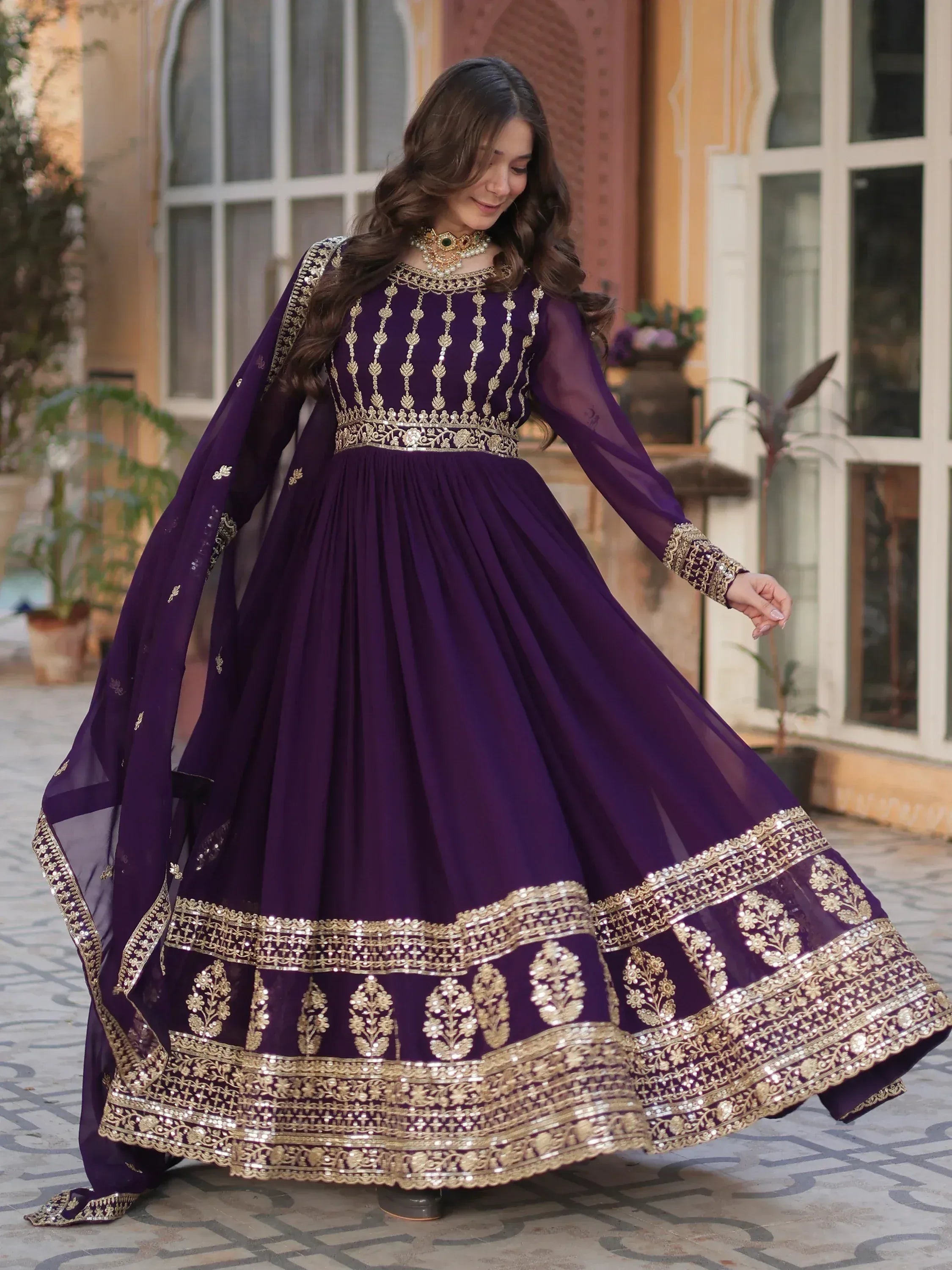 Elegant purple anarkali with gold embroidery, perfect for Indian ethnic wear and festive occasions.