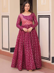 Woman in maroon ethnic gown with gold print, Indian designer dress from Ethnic Plus