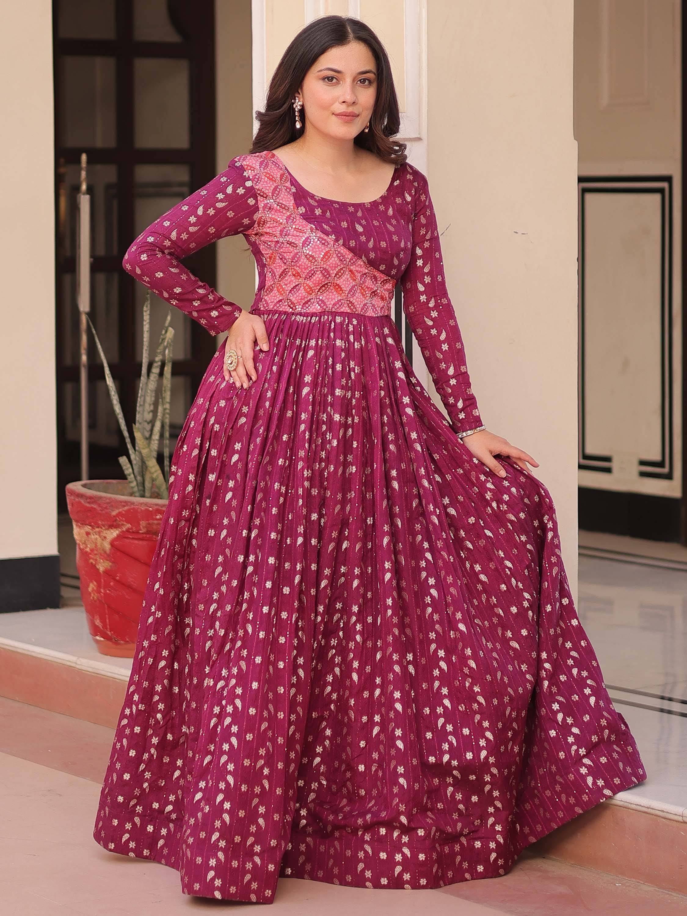 Elegant maroon ethnic gown with floral print, perfect for Indian celebrations and festive occasions.