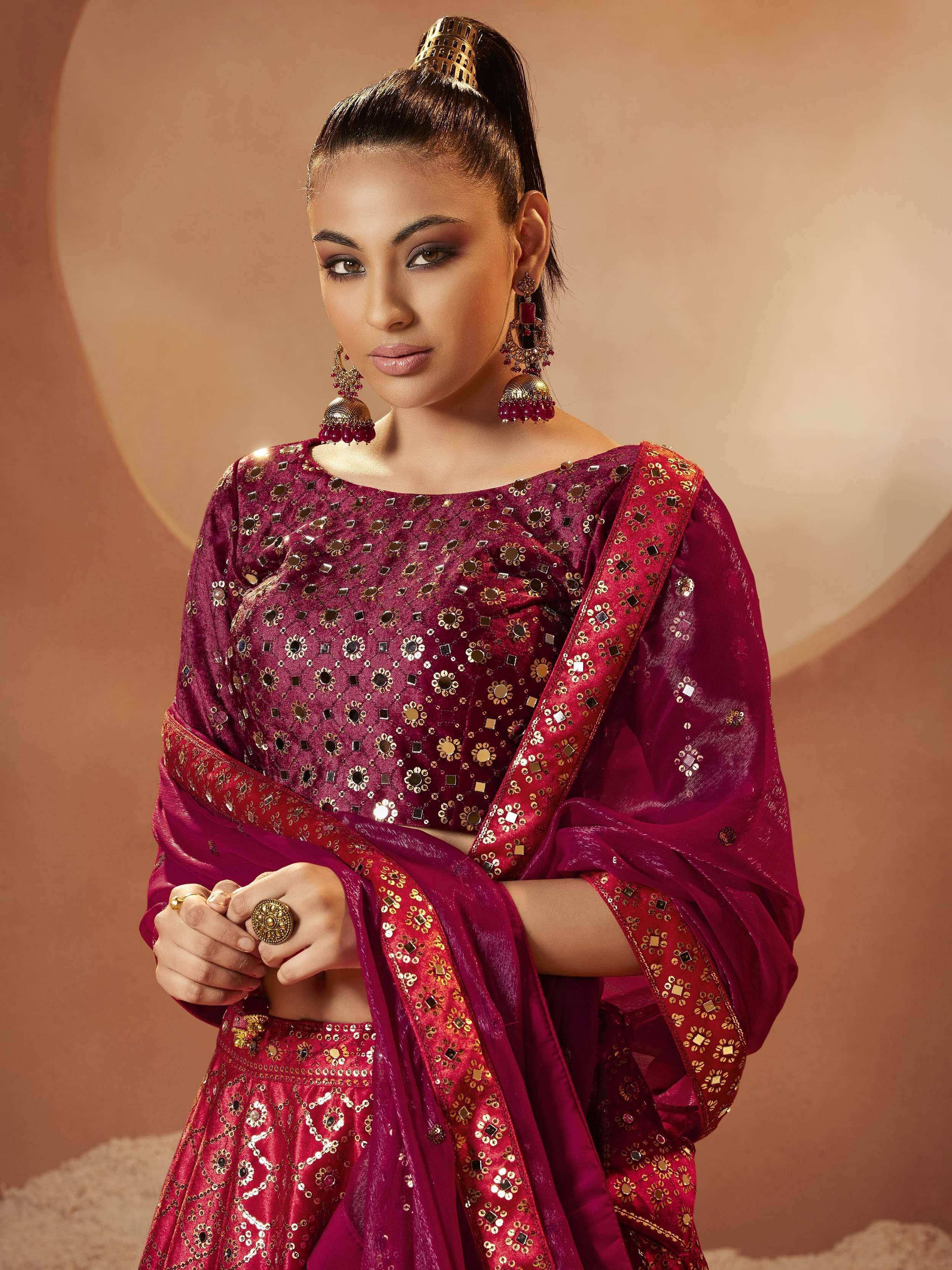 Elegant maroon lehenga choli with mirror work, perfect for Indian ethnic wear and festive occasions.
