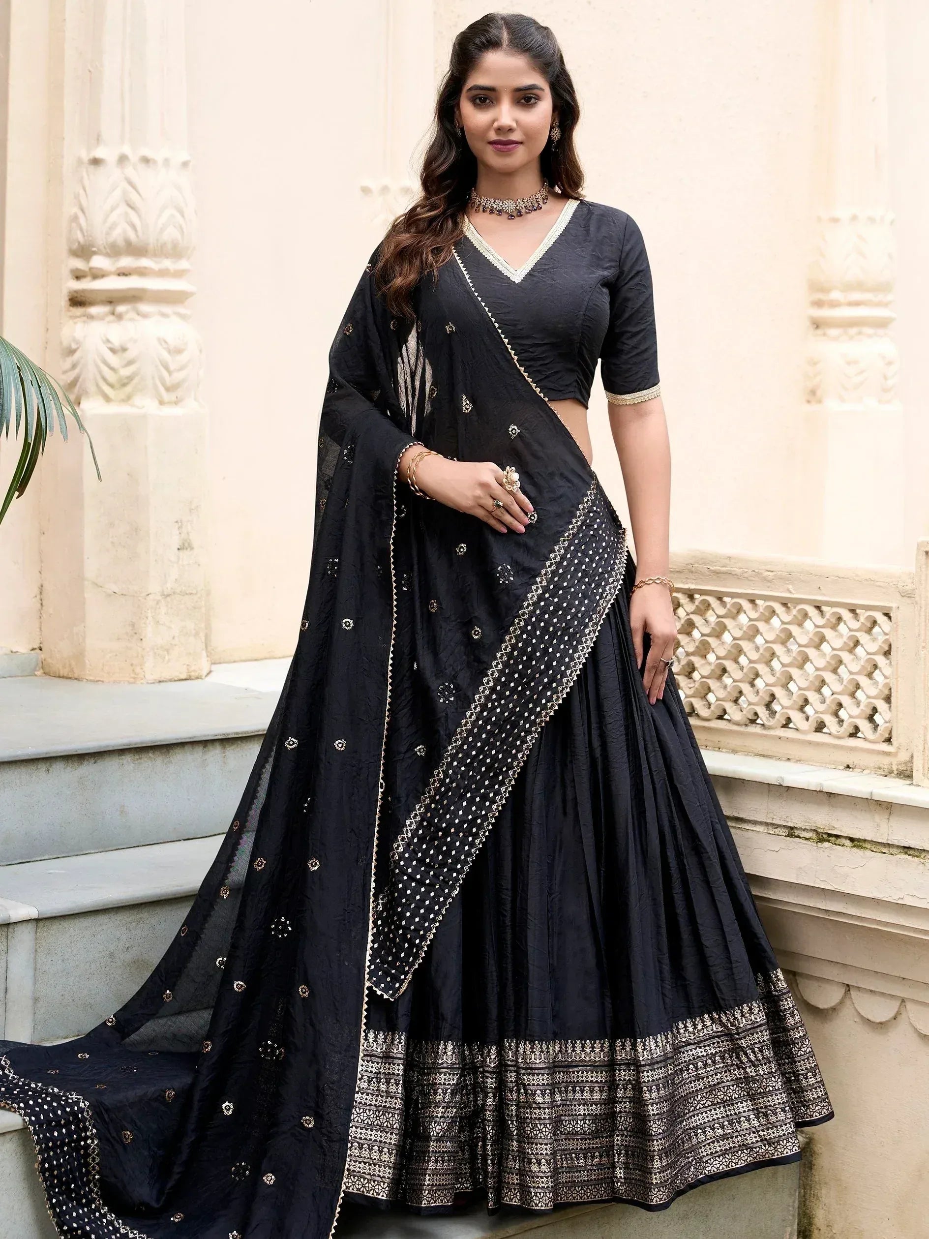 Black designer lehenga choli with gold embroidery, perfect for Indian ethnic wear occasions