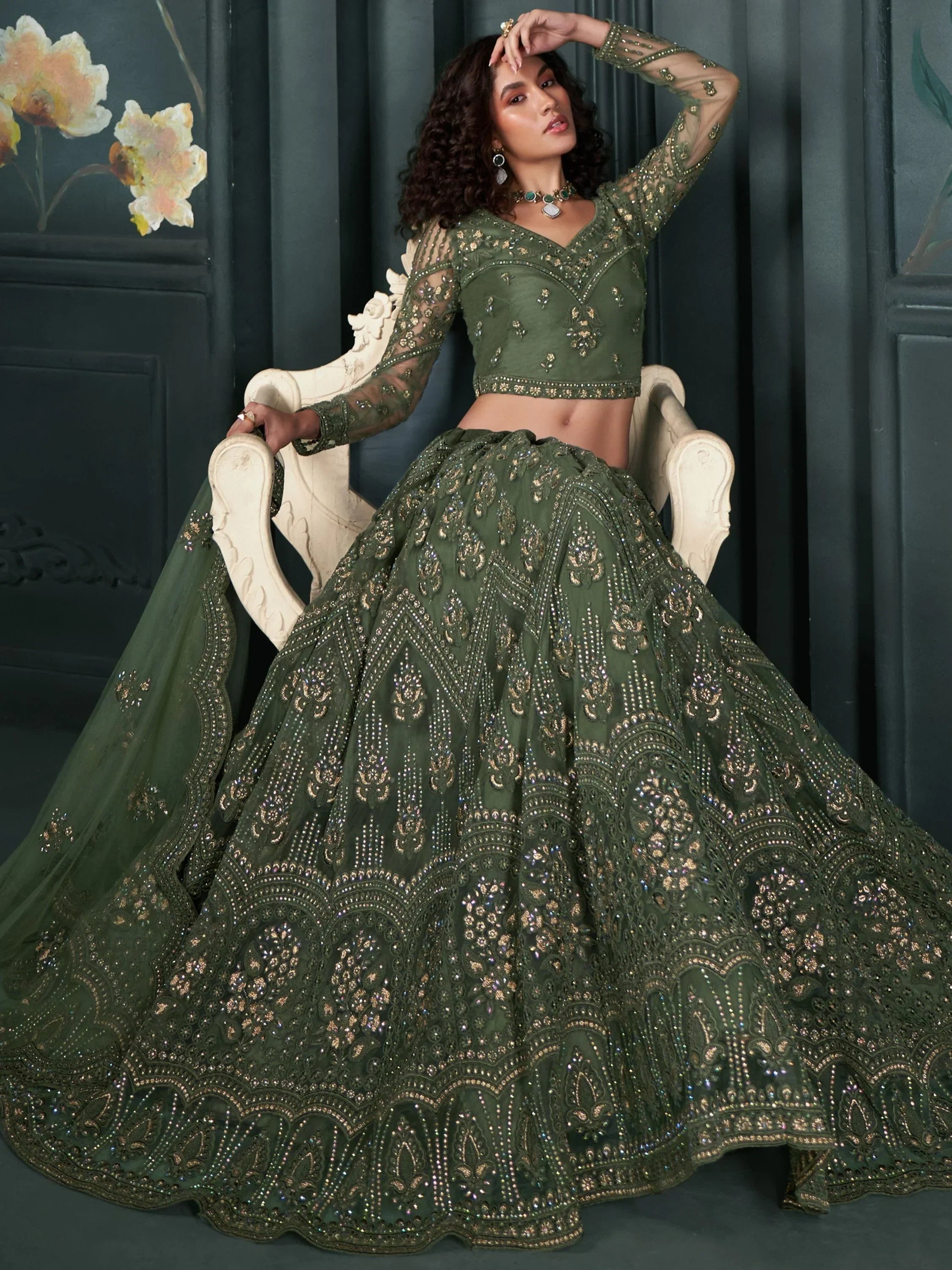 Elegant green embroidered lehenga choli with intricate gold detailing, perfect for Indian ethnic wear.