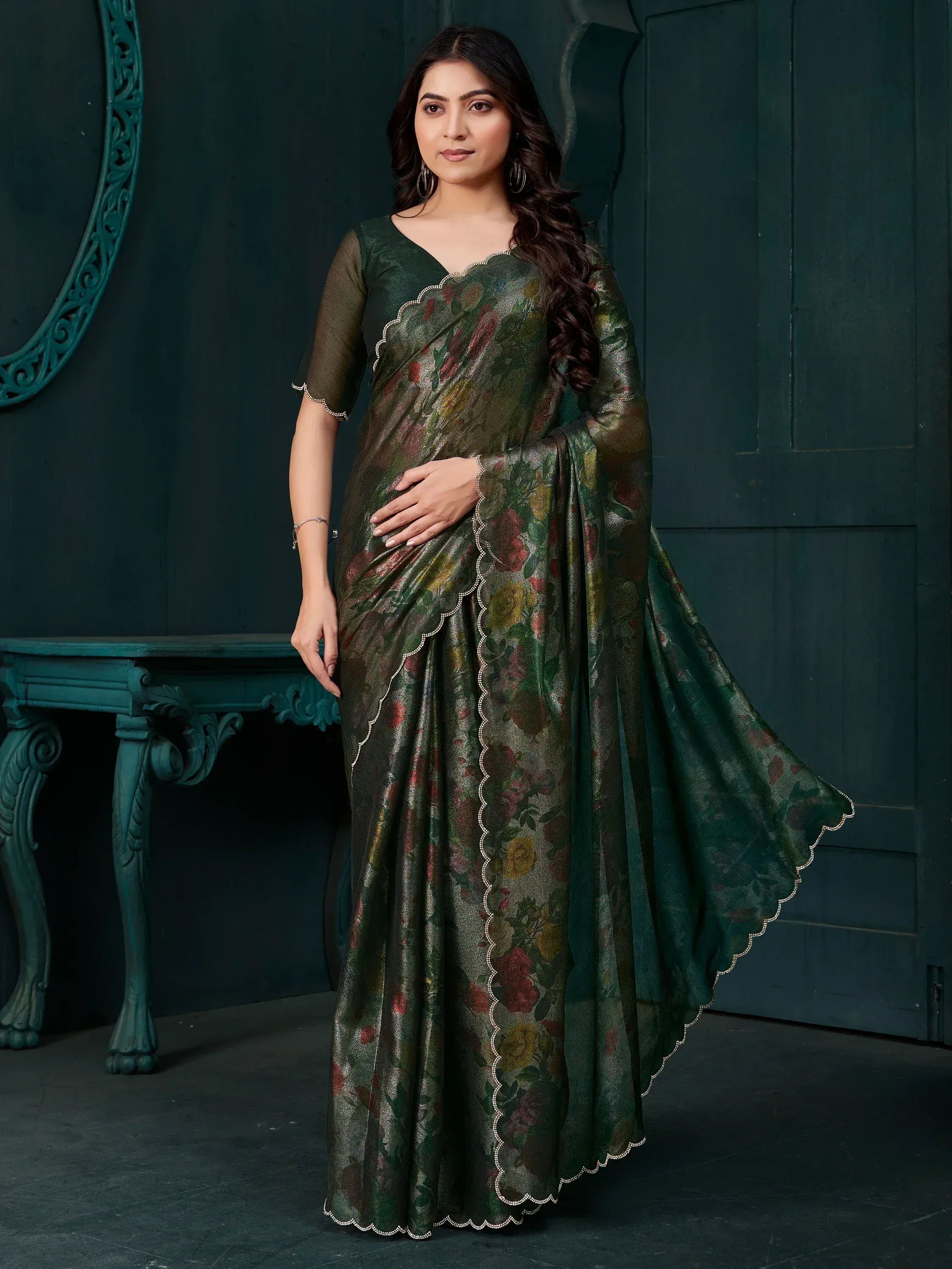 Elegant green floral saree with scalloped border, perfect for Indian ethnic wear occasions