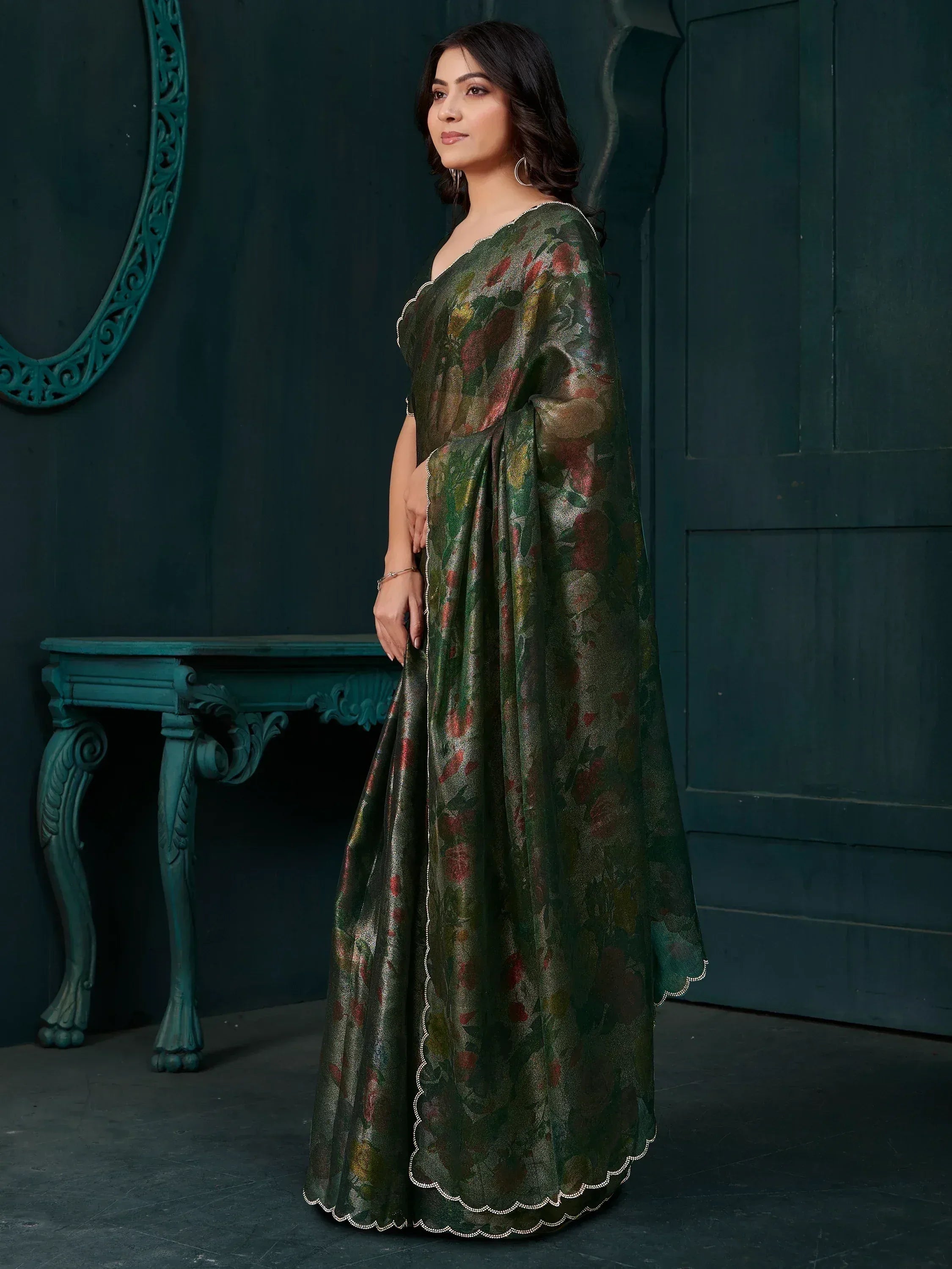 Elegant green floral saree with scalloped border, perfect for Indian ethnic wear occasions