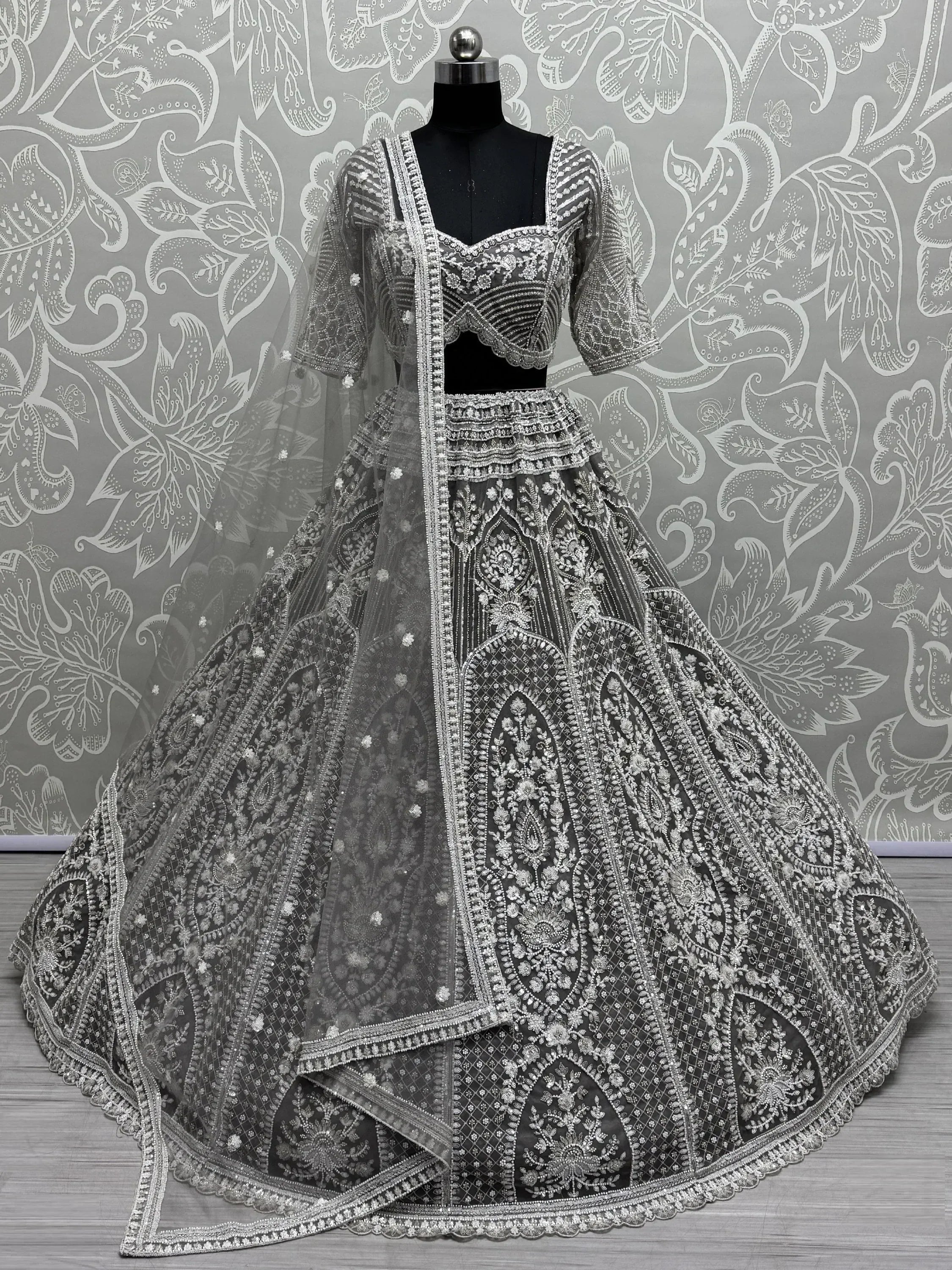 Black and silver embroidered lehenga choli with heavy zari work, perfect for weddings and festive occasions