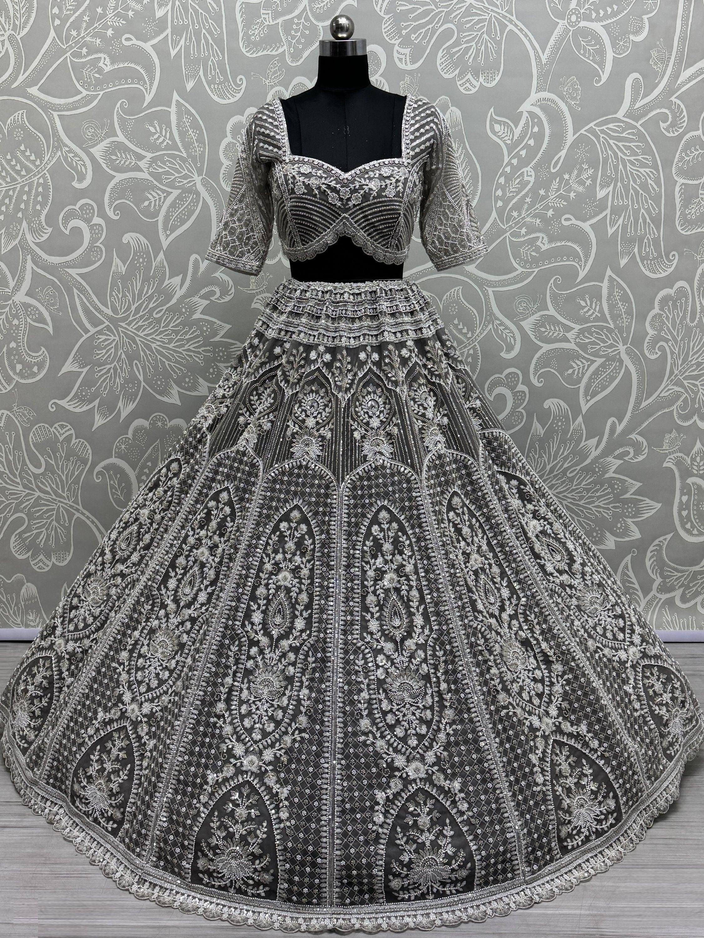 Elegant black and silver designer lehenga choli with heavy embroidery, perfect for weddings and festive occasions.