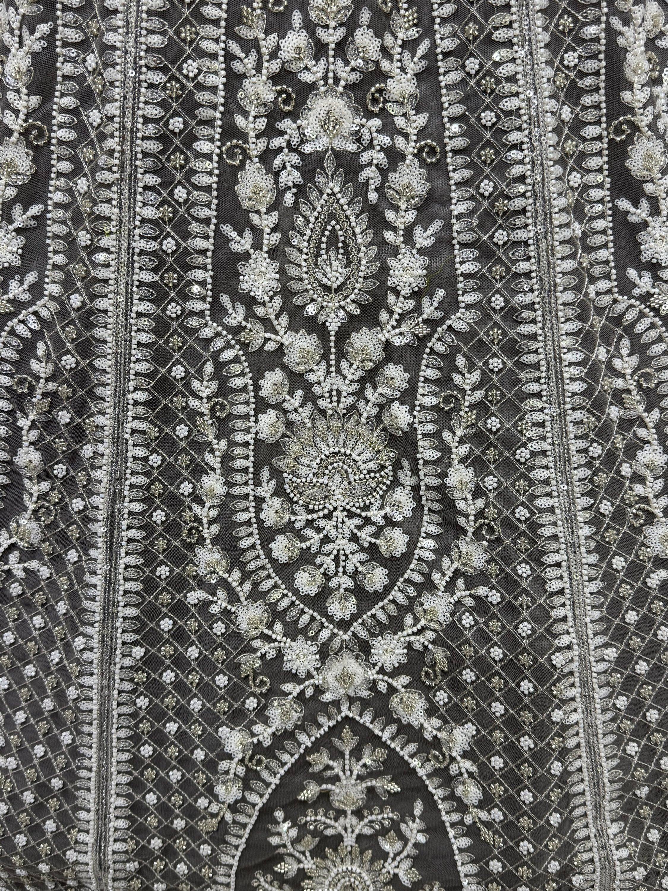 Exquisite silver floral embroidery on dark net fabric for designer lehenga choli or ethnic gown