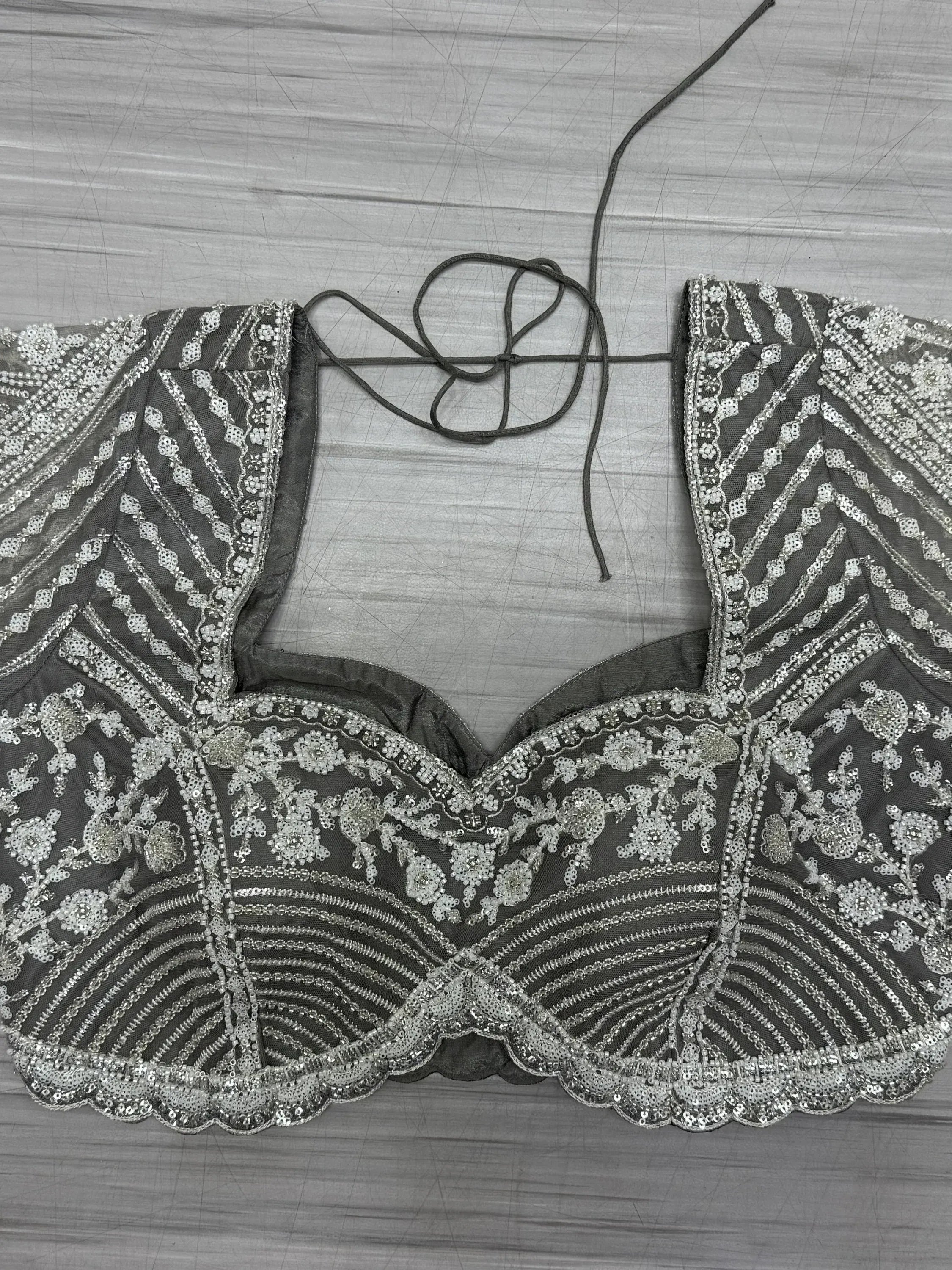 Grey embroidered lehenga choli blouse with silver sequins and floral beadwork, perfect for Indian ethnic wear.
