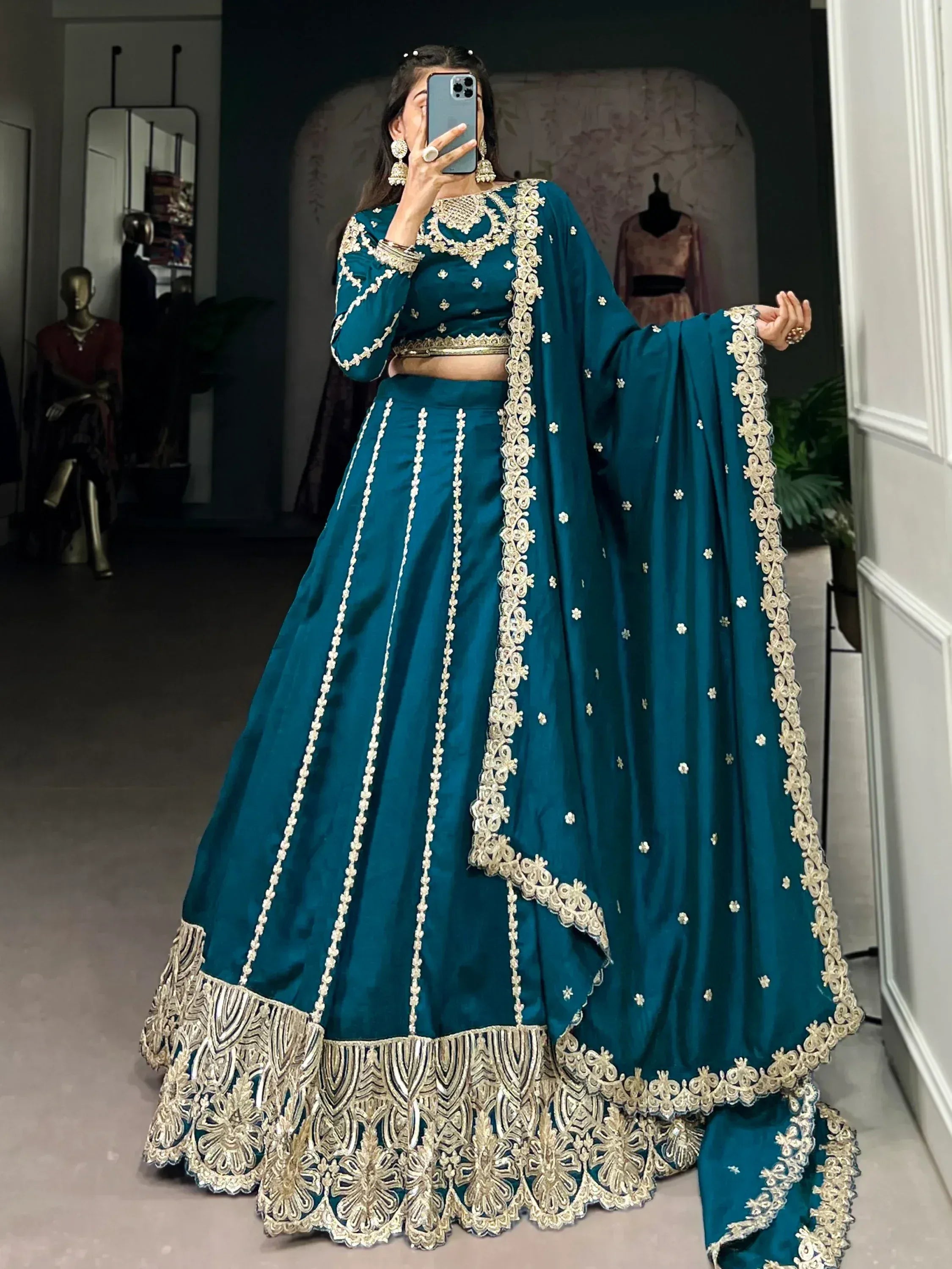 Teal designer lehenga choli with gold embroidery, perfect for Indian ethnic wear and festive occasions.