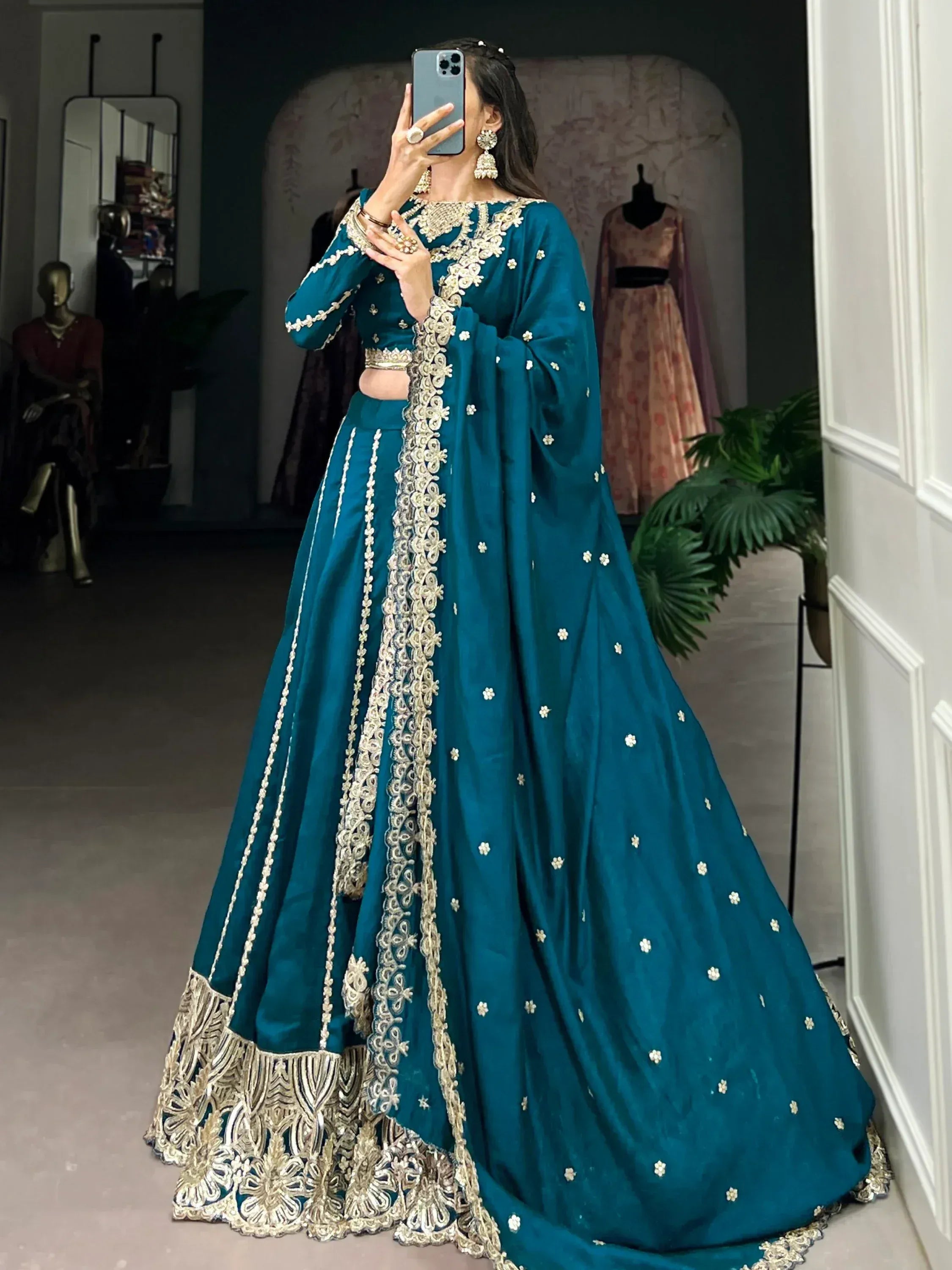 Teal designer lehenga choli with gold embroidery, perfect for weddings and festive occasions