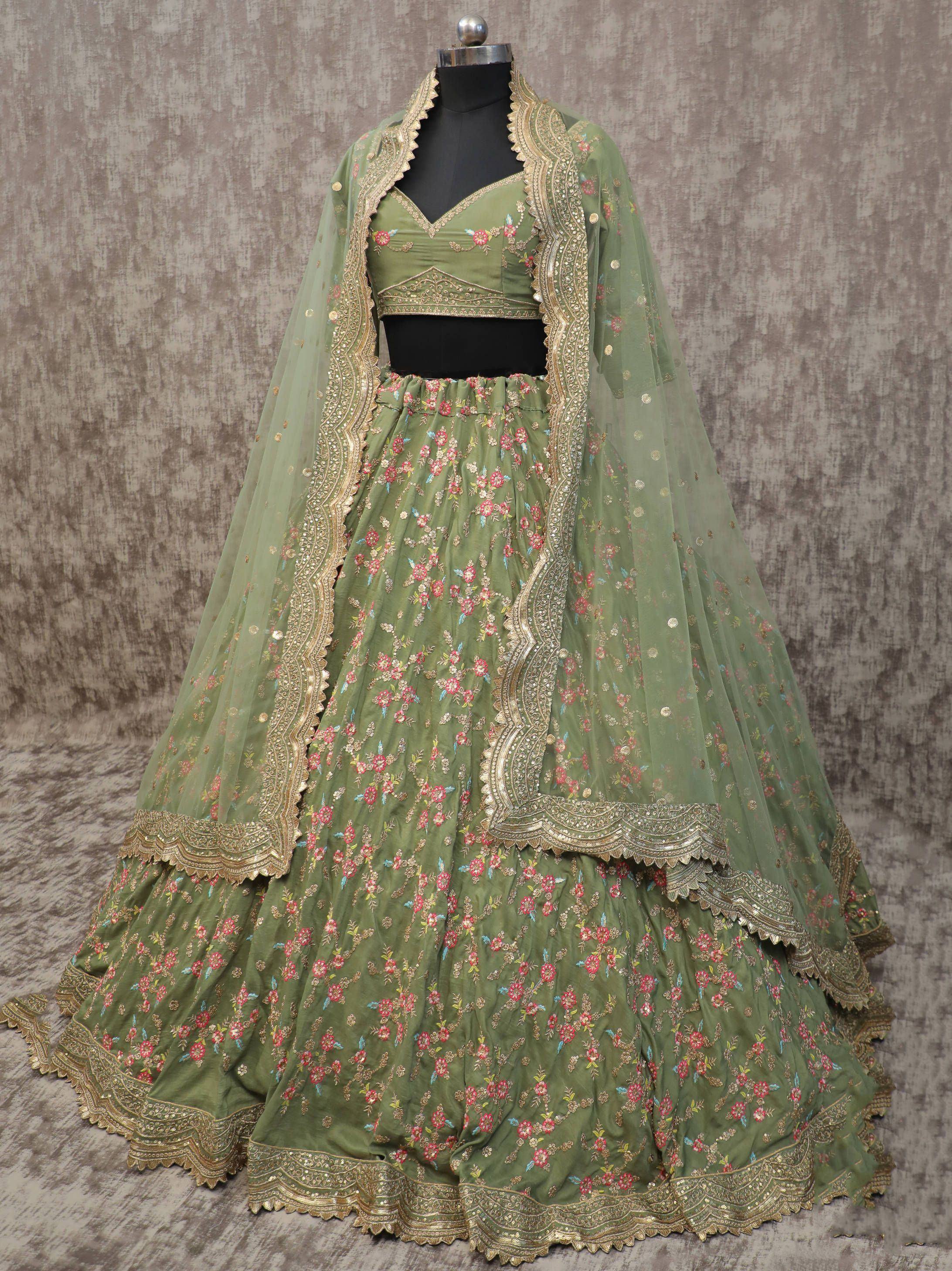 Olive green embroidered lehenga choli with floral motifs and gold border, perfect for Indian ethnic occasions