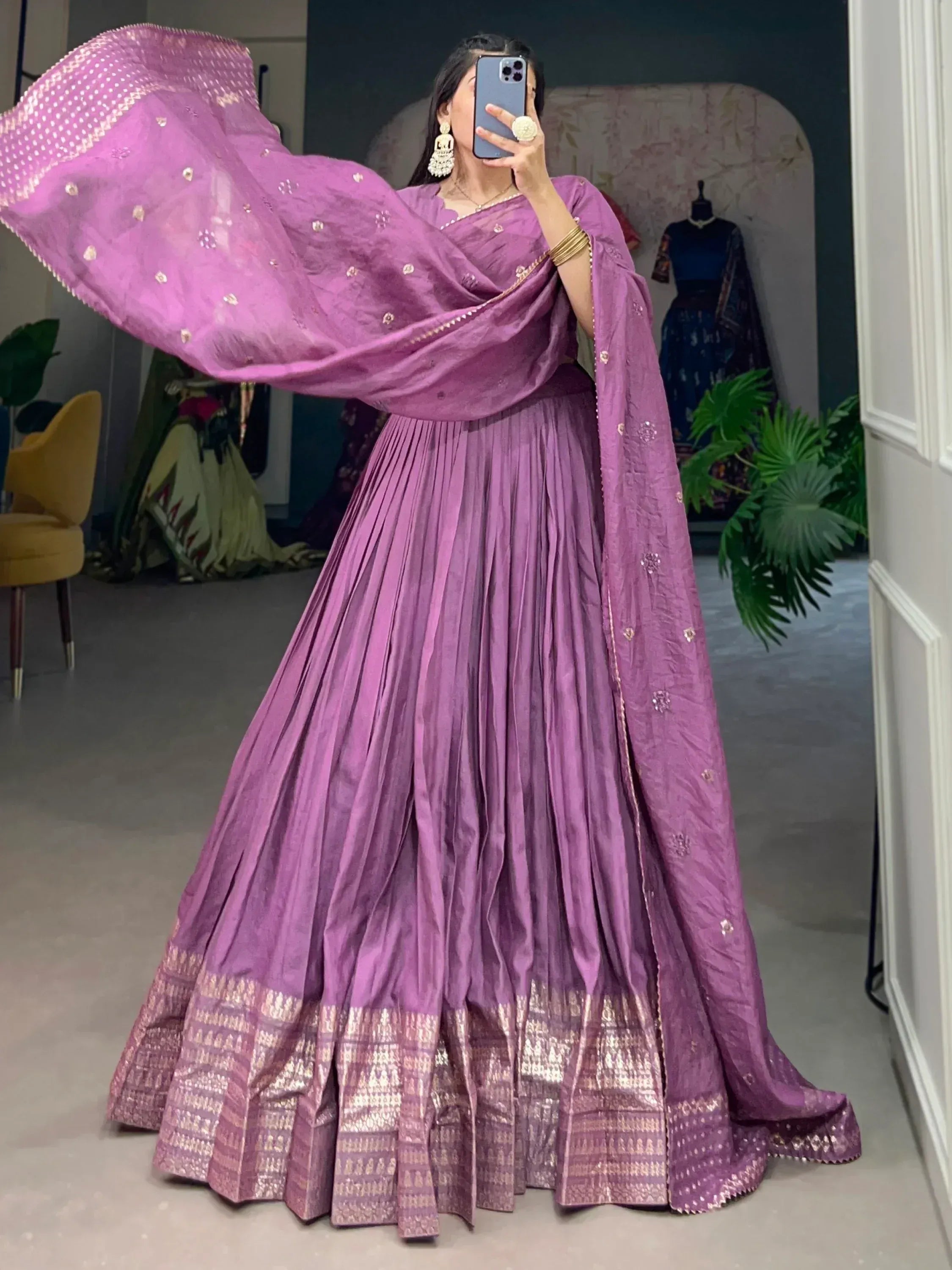 Purple lehenga choli with gold embroidery and pleated skirt, perfect for Indian ethnic wear occasions