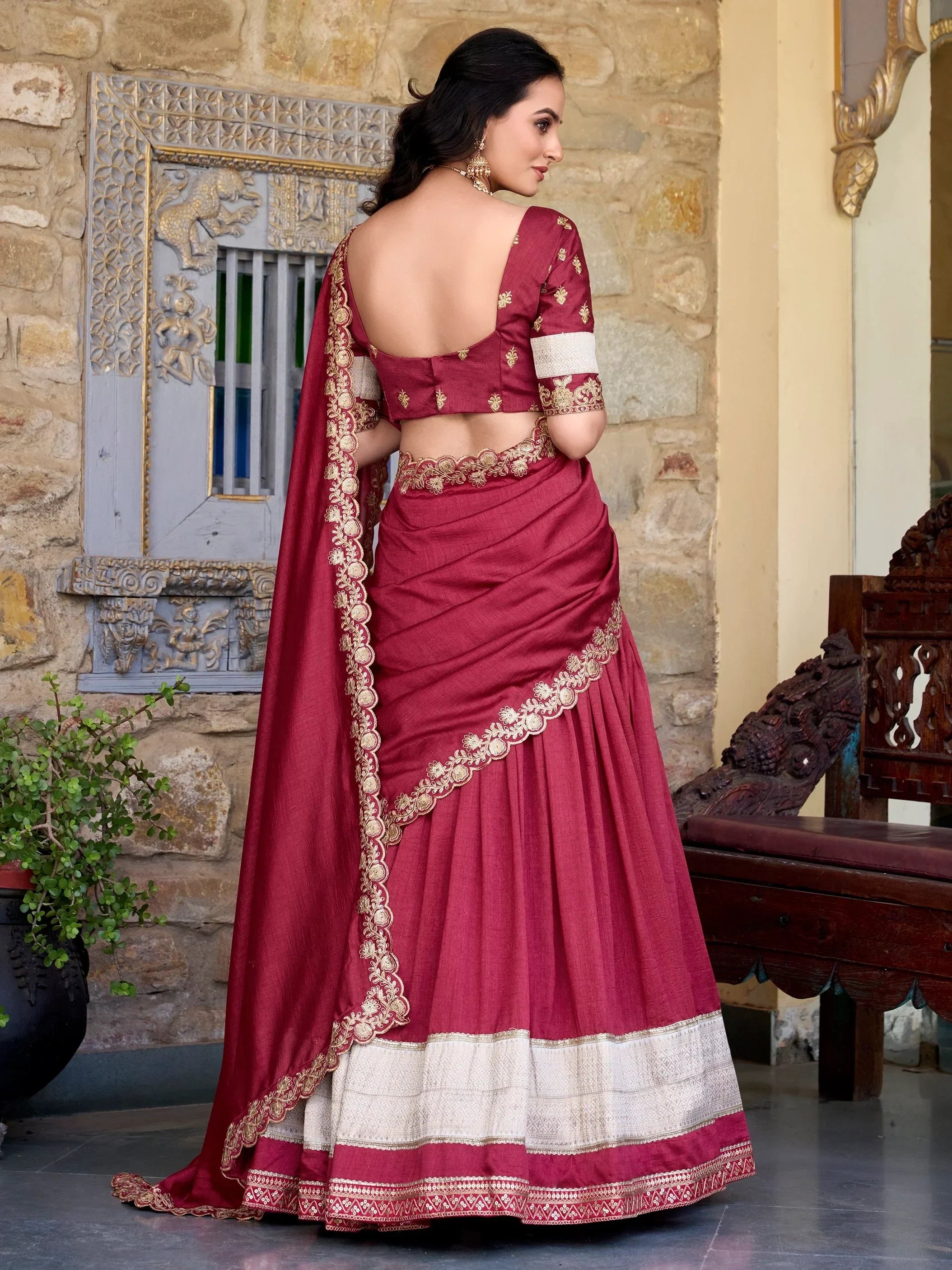 Maroon designer lehenga choli with gold embroidery, perfect for Indian weddings and festive occasions