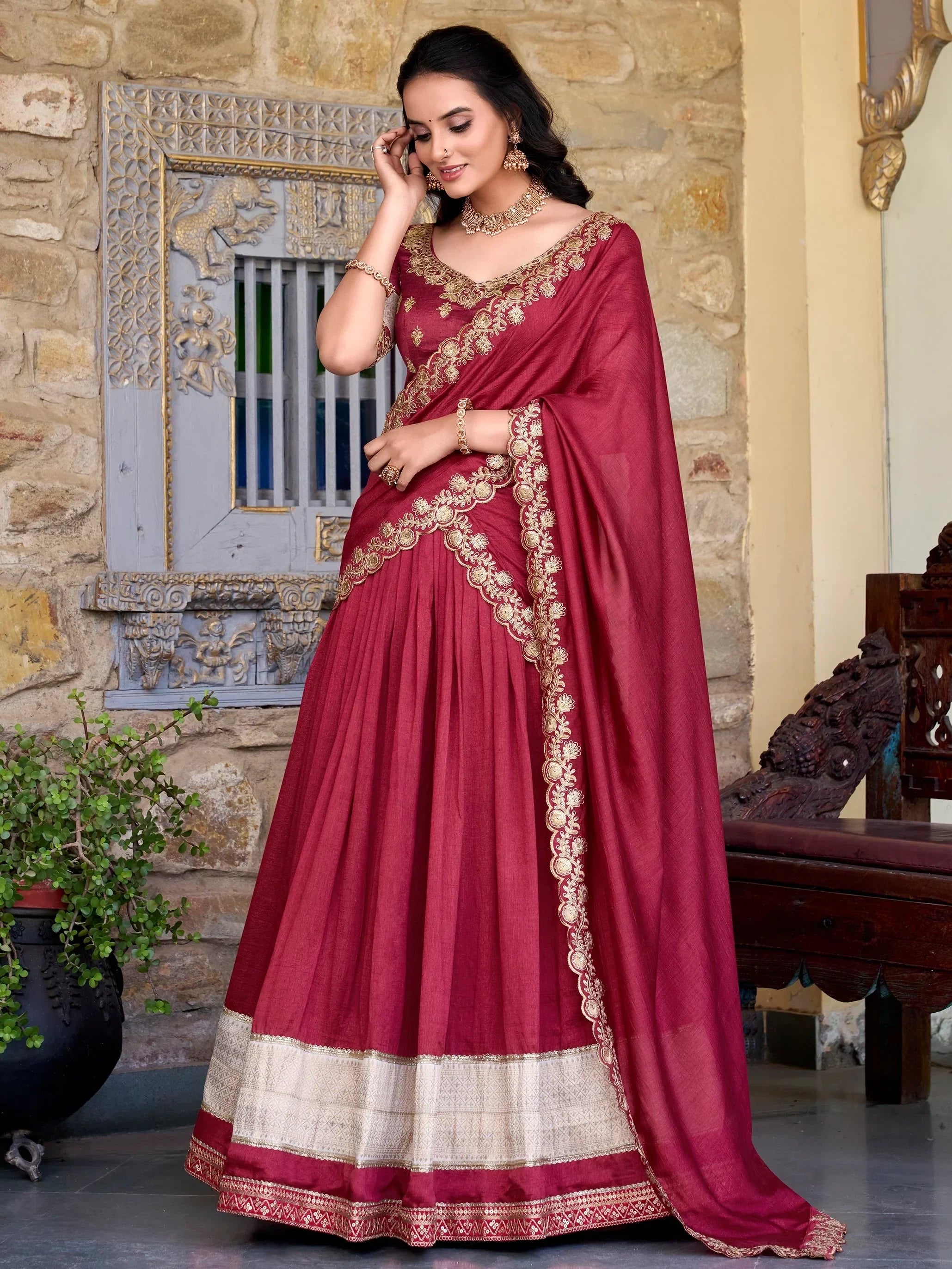 Maroon designer lehenga choli with gold embroidery, perfect for Indian ethnic wear occasions