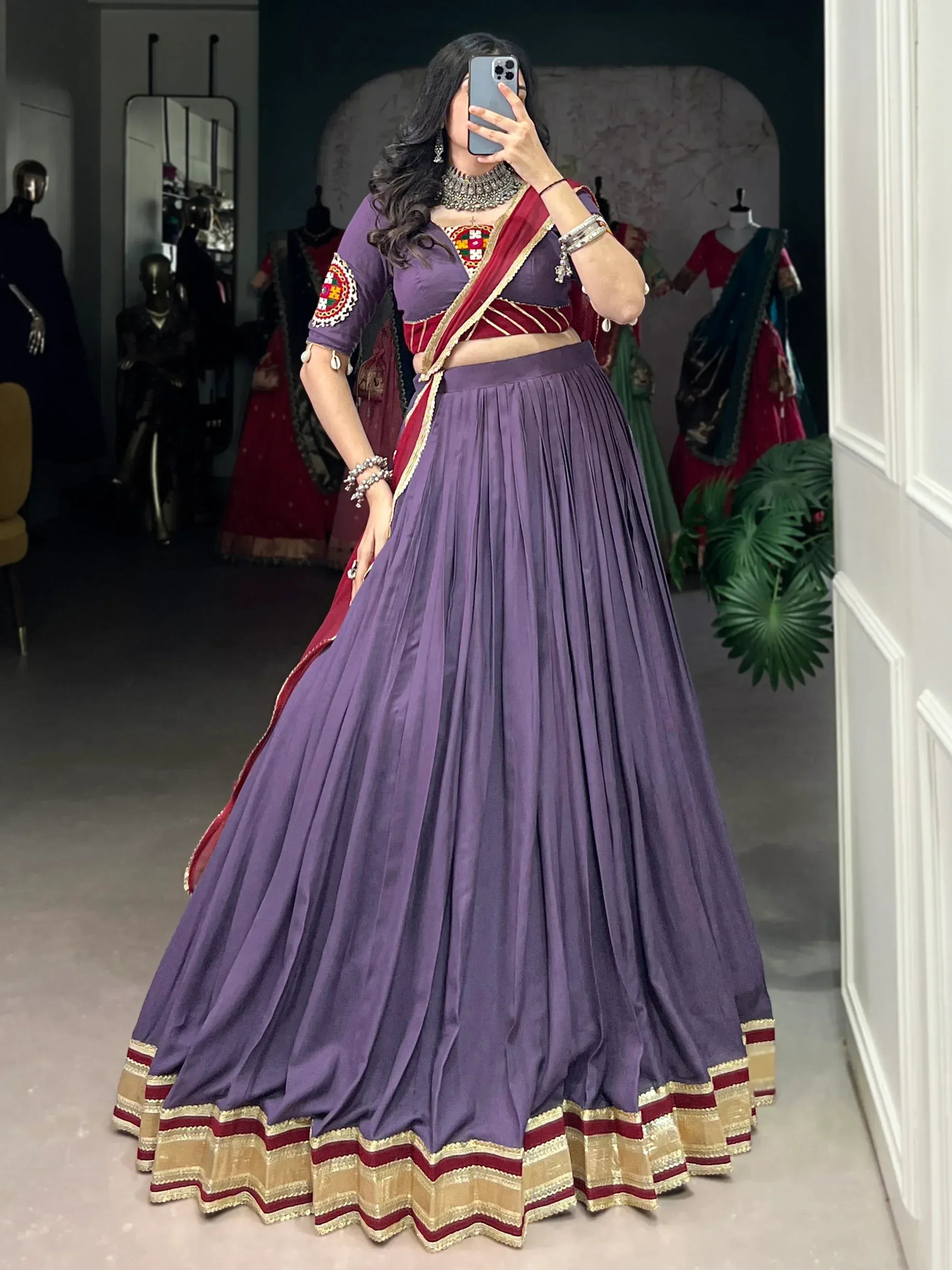 Purple pleated lehenga choli with maroon dupatta, ethnic Indian wear for weddings and festivals
