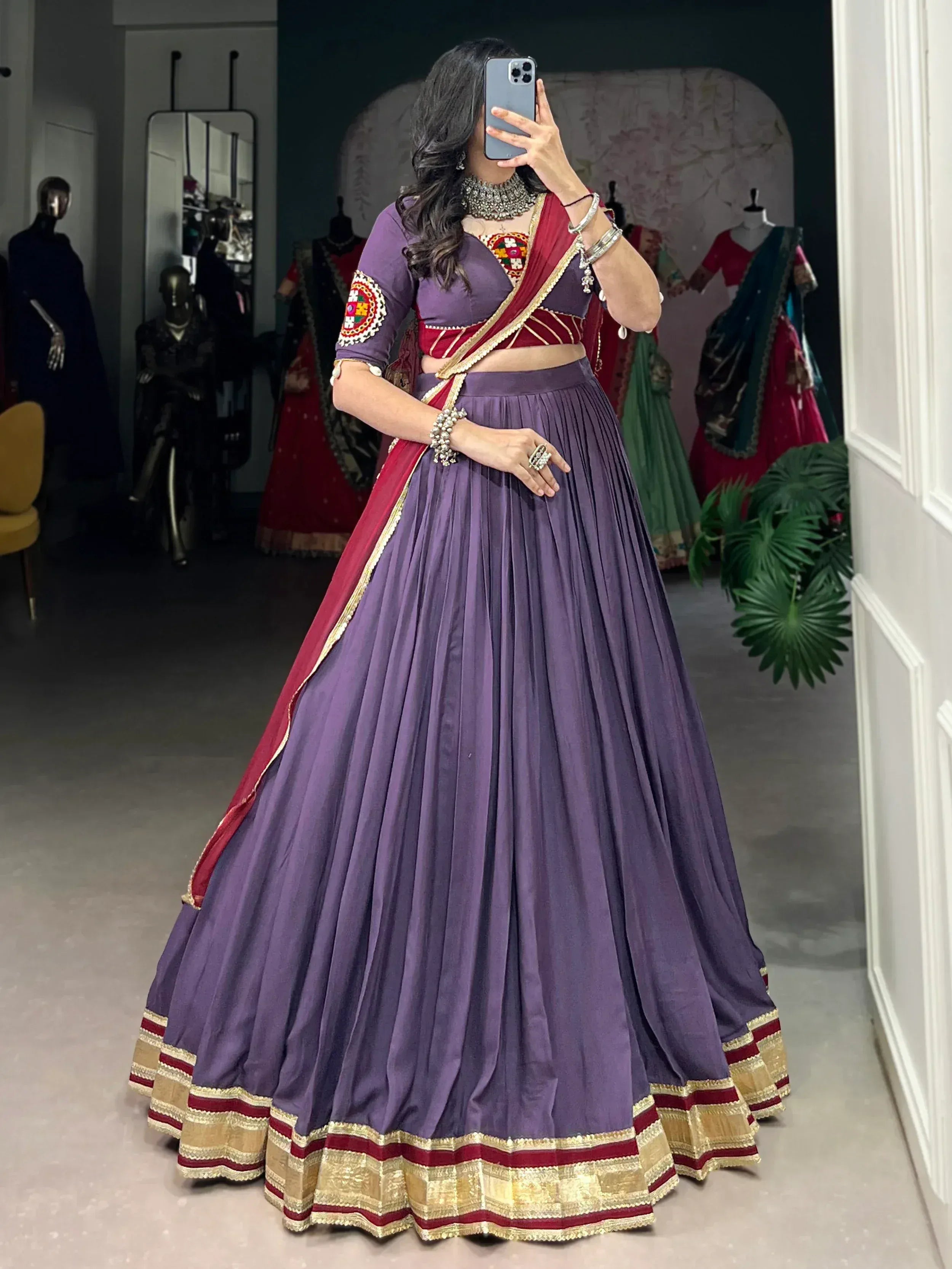 Purple and maroon designer lehenga choli with gold trim, perfect for Indian ethnic wear occasions