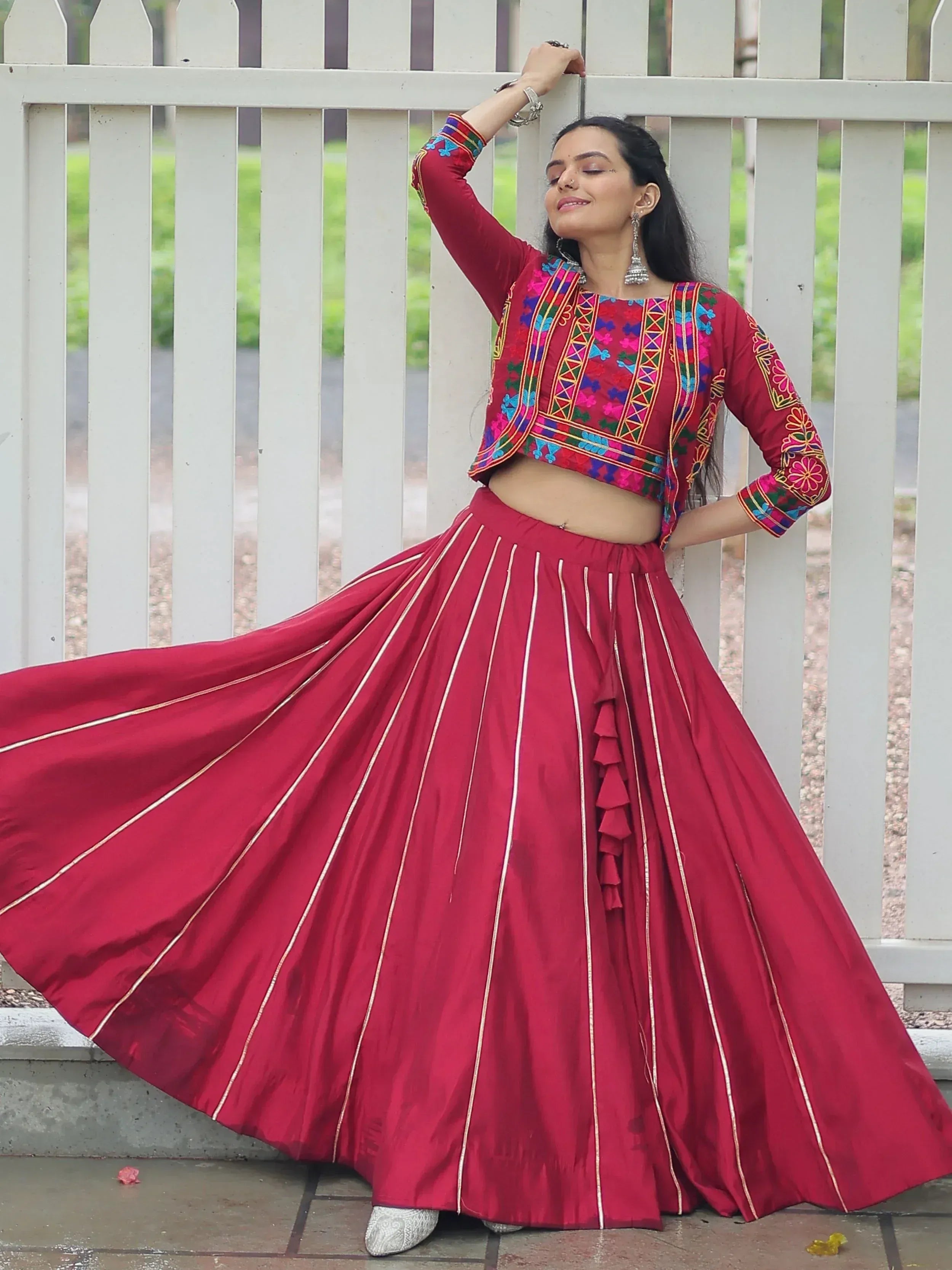 Red embroidered lehenga choli with gold stripes, perfect for Indian ethnic wear
