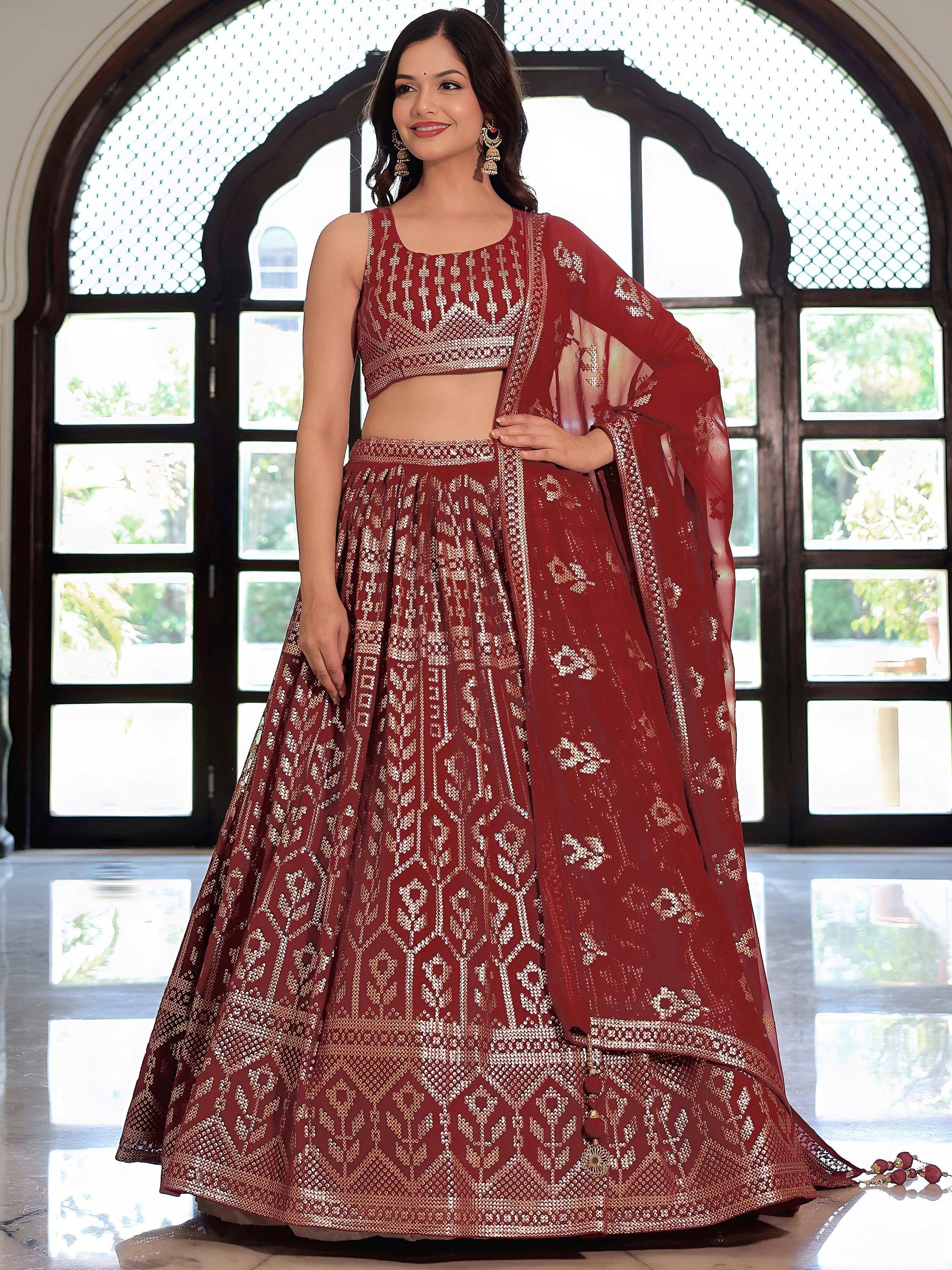 Maroon designer lehenga choli with gold embroidery, perfect for Indian ethnic wear and festive occasions.