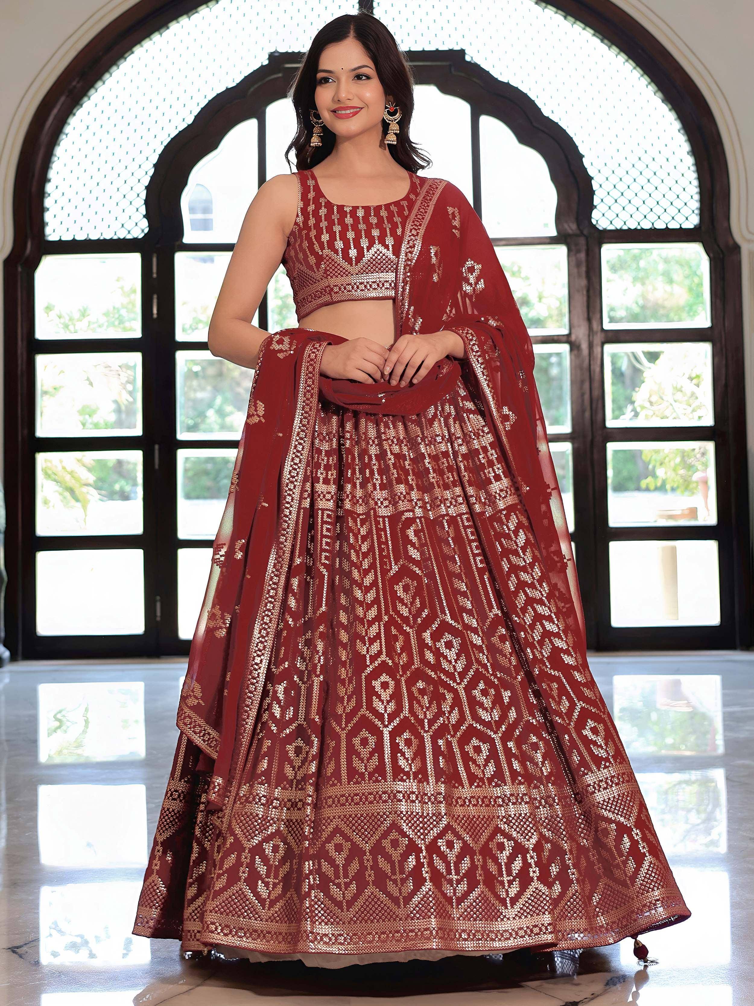 Maroon designer lehenga choli with gold embroidery, perfect for Indian weddings and festive occasions.