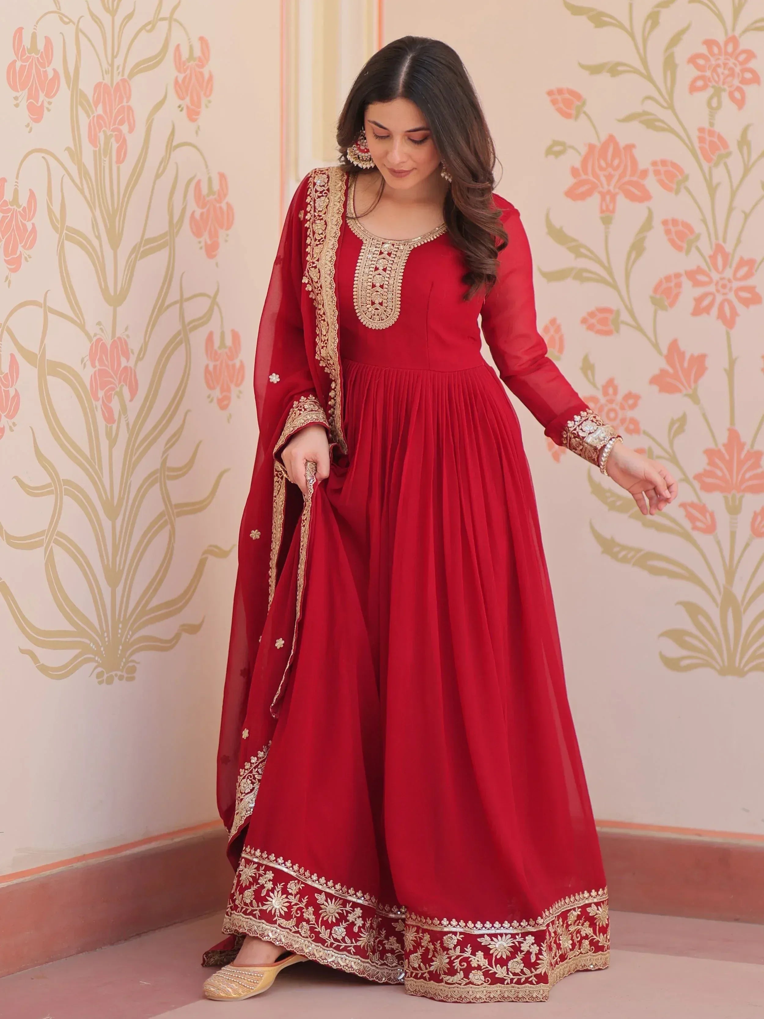 Red ethnic anarkali suit with gold embroidery, perfect for Indian weddings and festive occasions