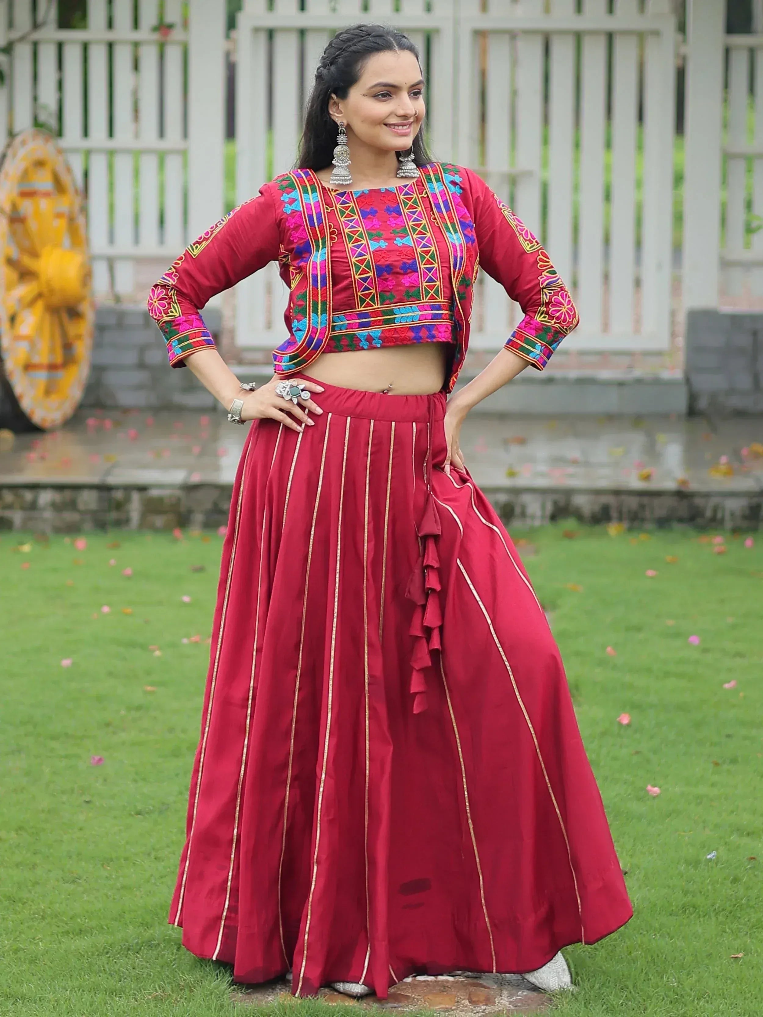 Red embroidered lehenga choli with gold stripes, perfect for Indian ethnic wear