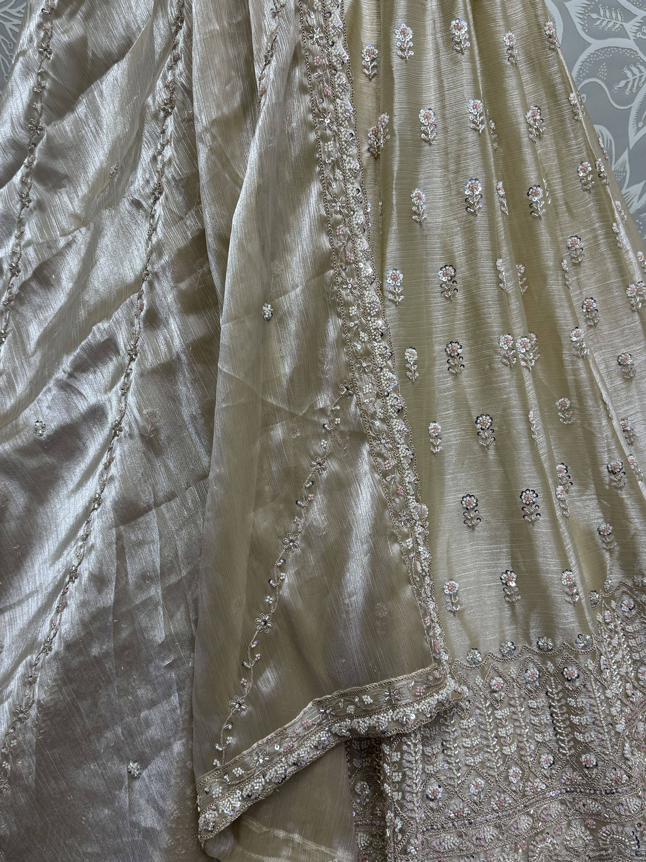 Elegant beige lehenga with floral sequin and bead embroidery, perfect for Indian ethnic wear