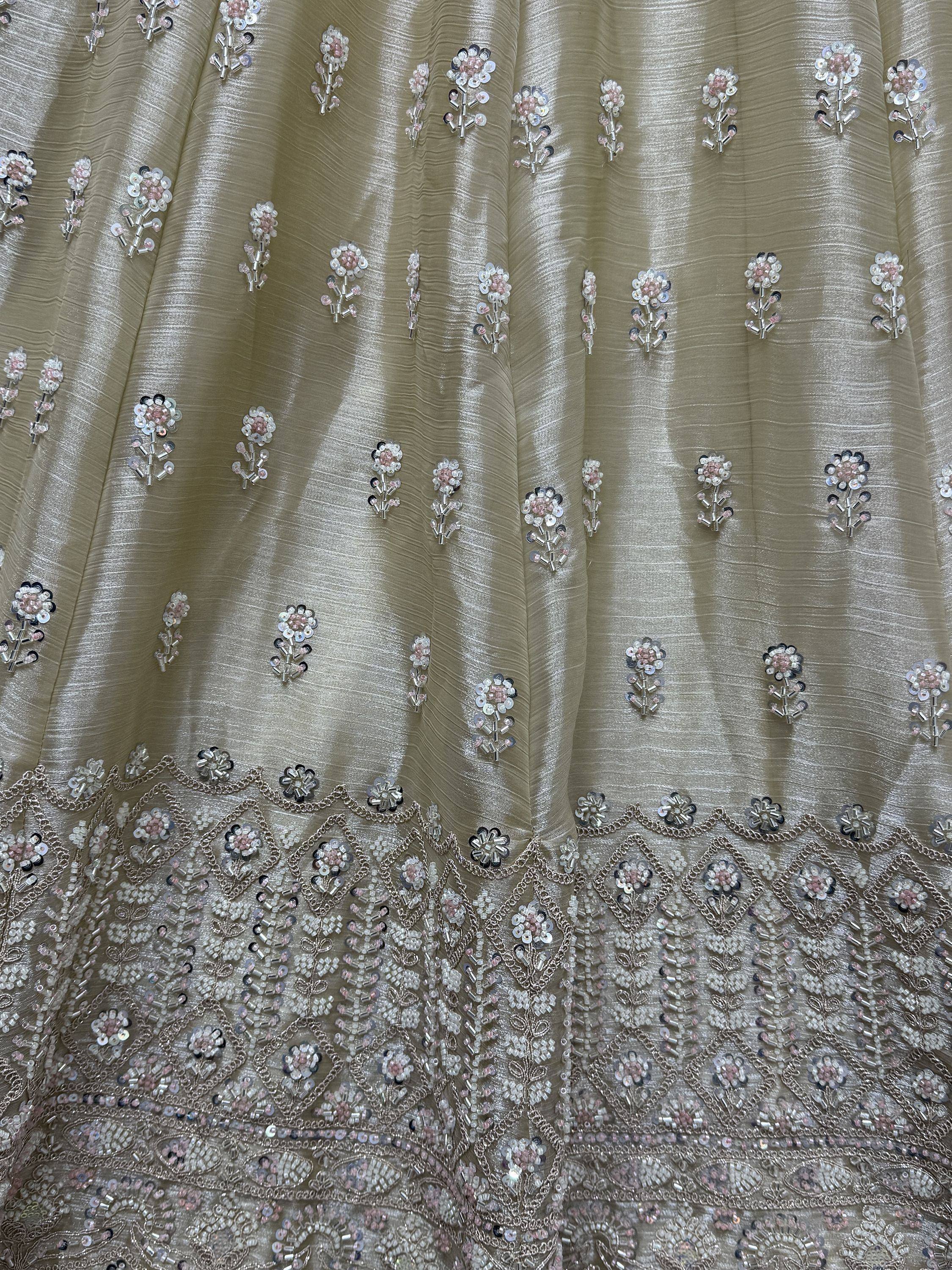 Beige ethnic gown with floral sequin and bead embroidery, perfect for Indian weddings or festive occasions.