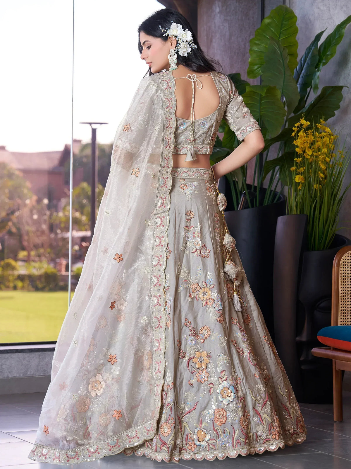 Elegant beige floral embroidered lehenga choli with sheer dupatta, perfect for Indian weddings and festive occasions.