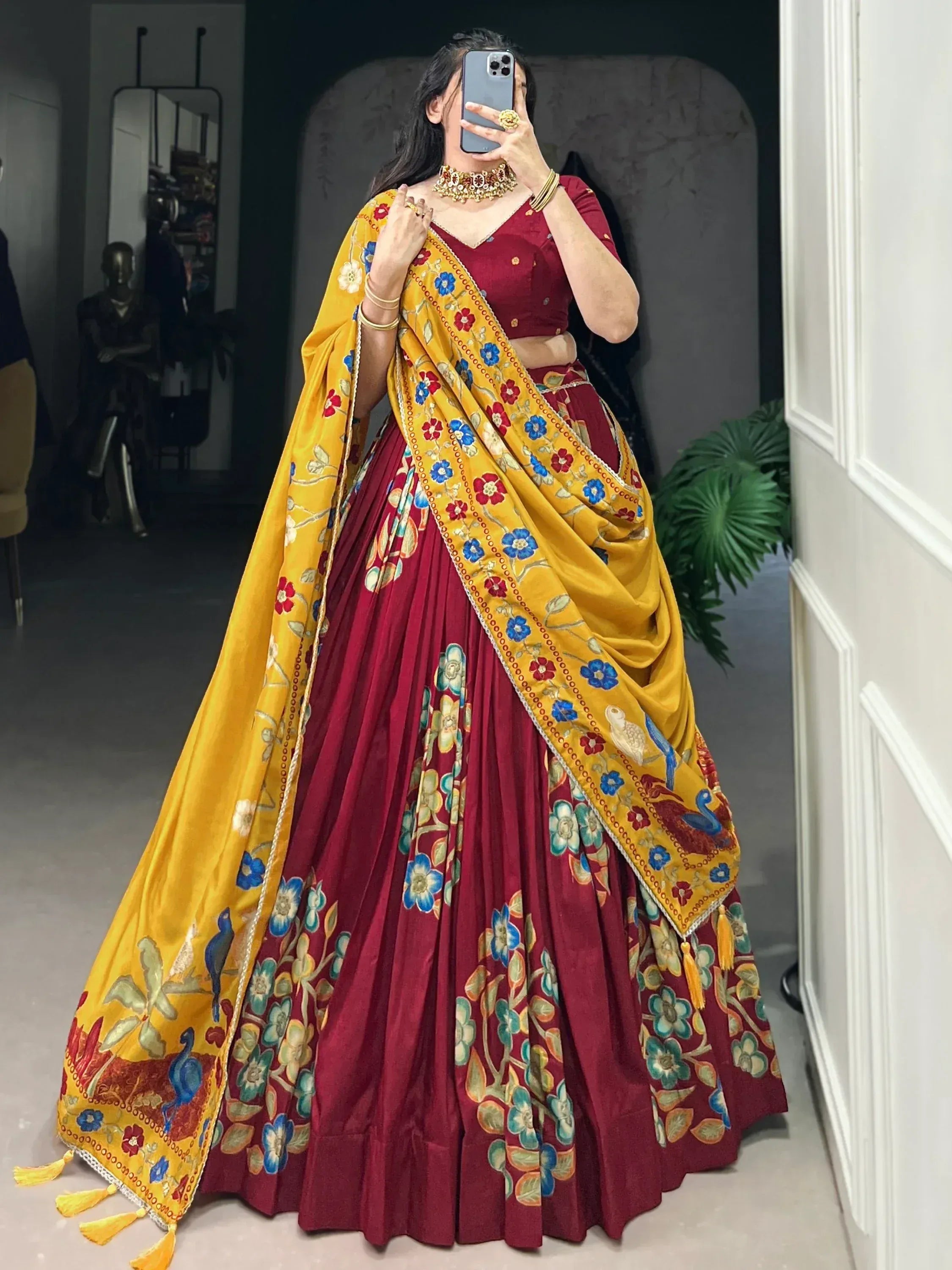 Maroon lehenga choli with yellow floral dupatta, perfect for Indian ethnic wear occasions