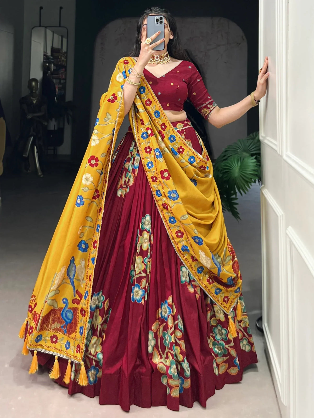 Maroon lehenga choli with yellow floral dupatta, perfect for Indian ethnic wear and festive occasions.
